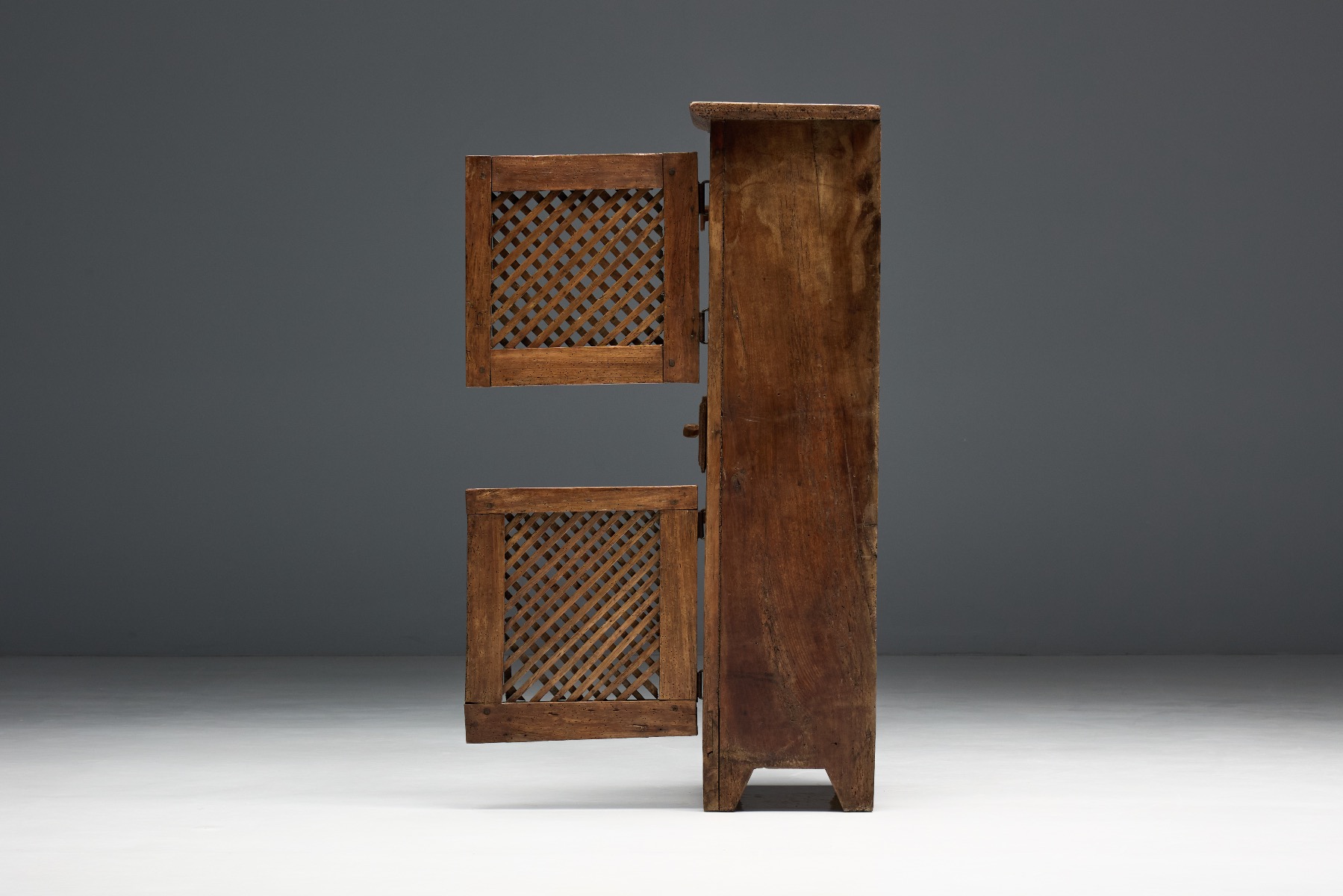 Handcrafted folk art cabinet with expressive detailing