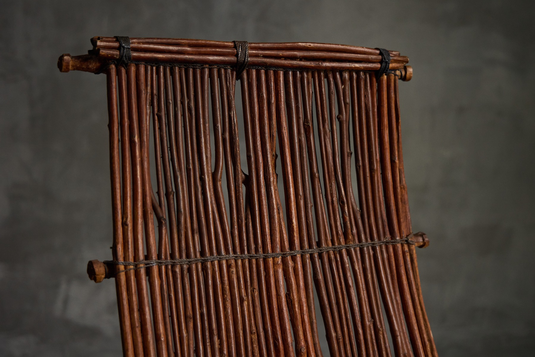 Mid century natural wicker lounge chair with rustic finish