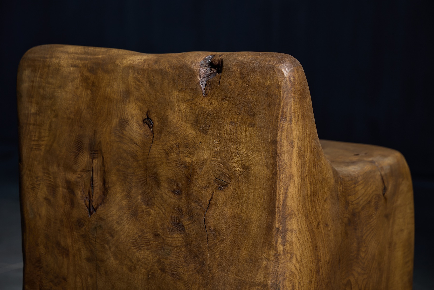 Refined artisan carved brutalist chair