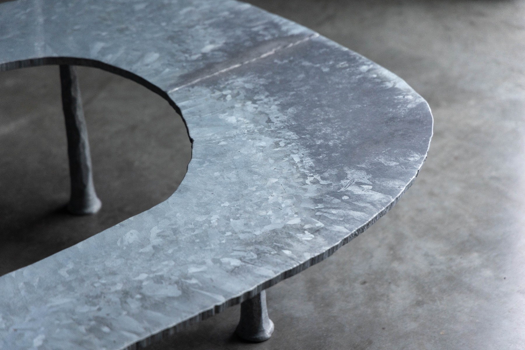 Modern sculptural coffee table with elliptical silhouette