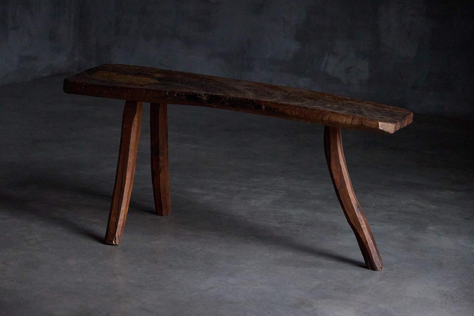 Rural brutalist tripod table in aged wood
