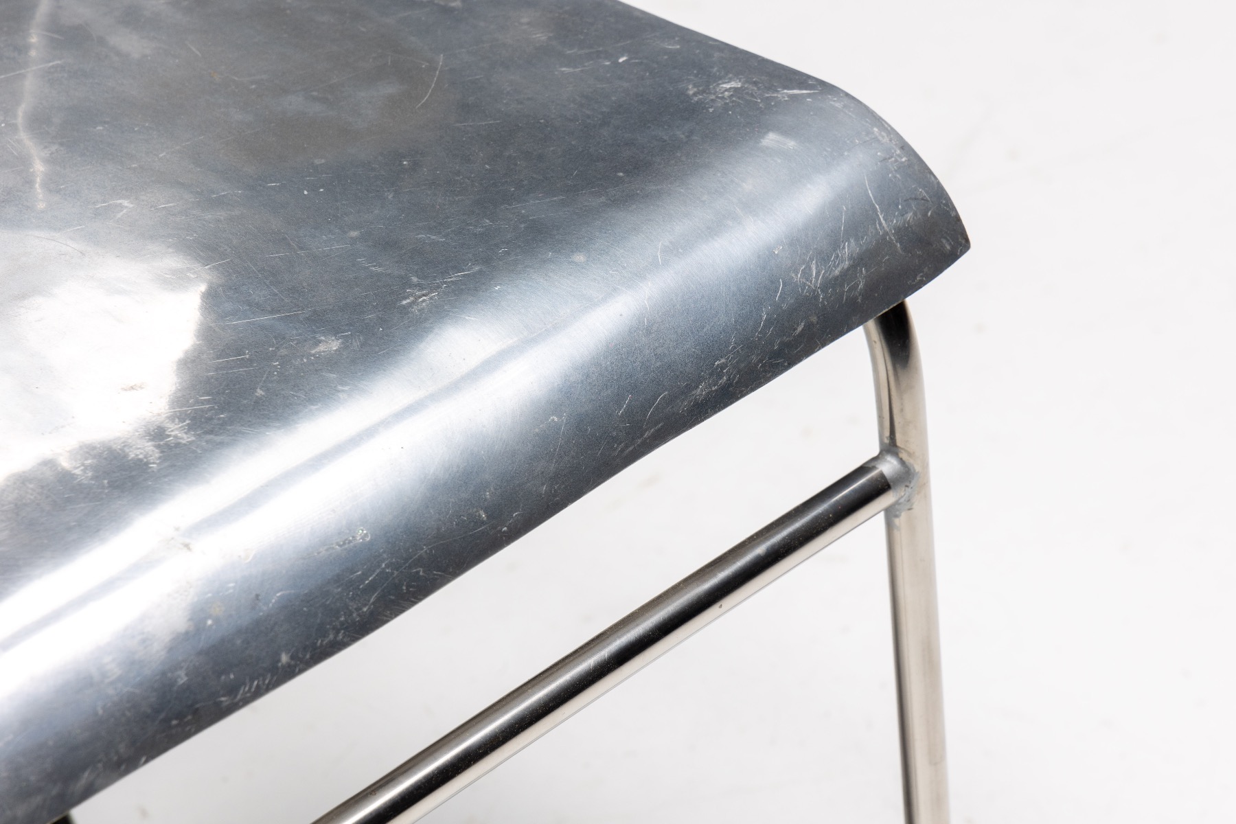 Sleek aluminum chairs in modernist 1980s style