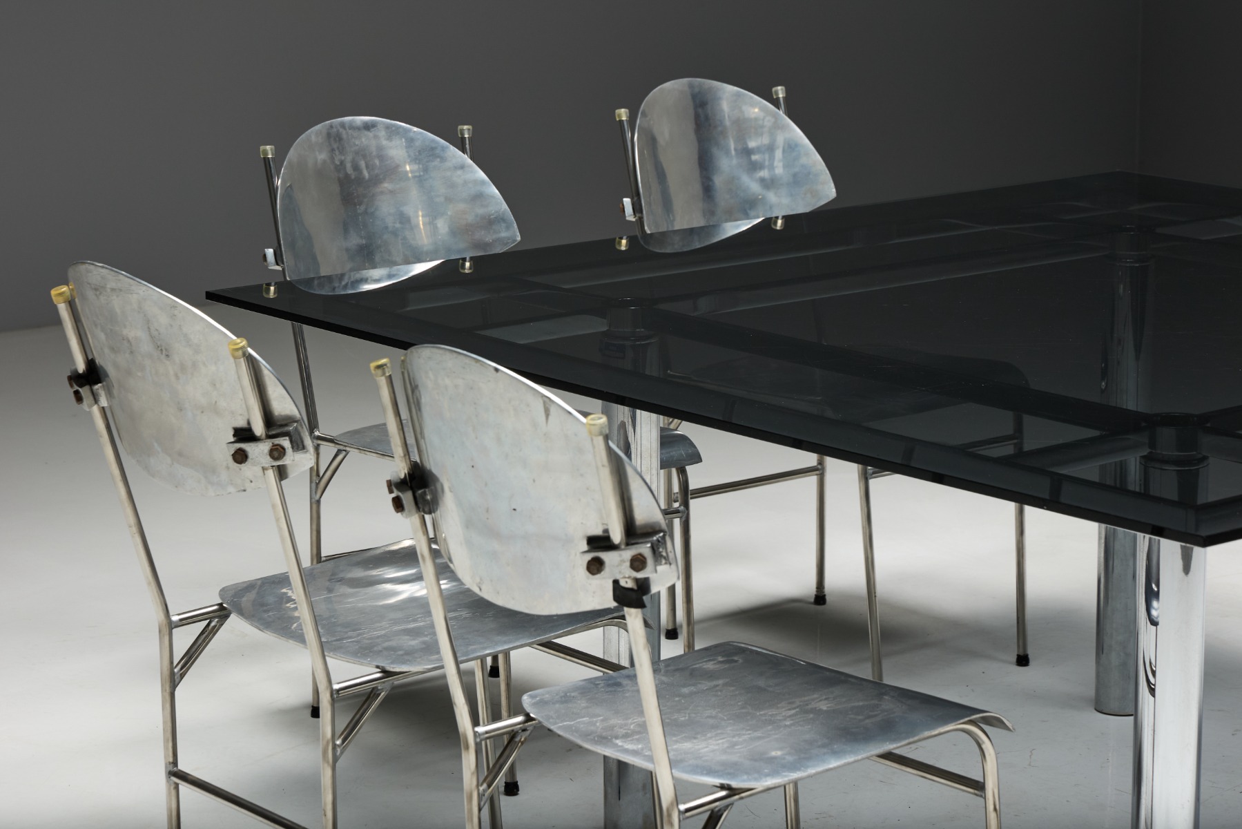 Sleek chrome dining table by Tobia Scarpa in modern style