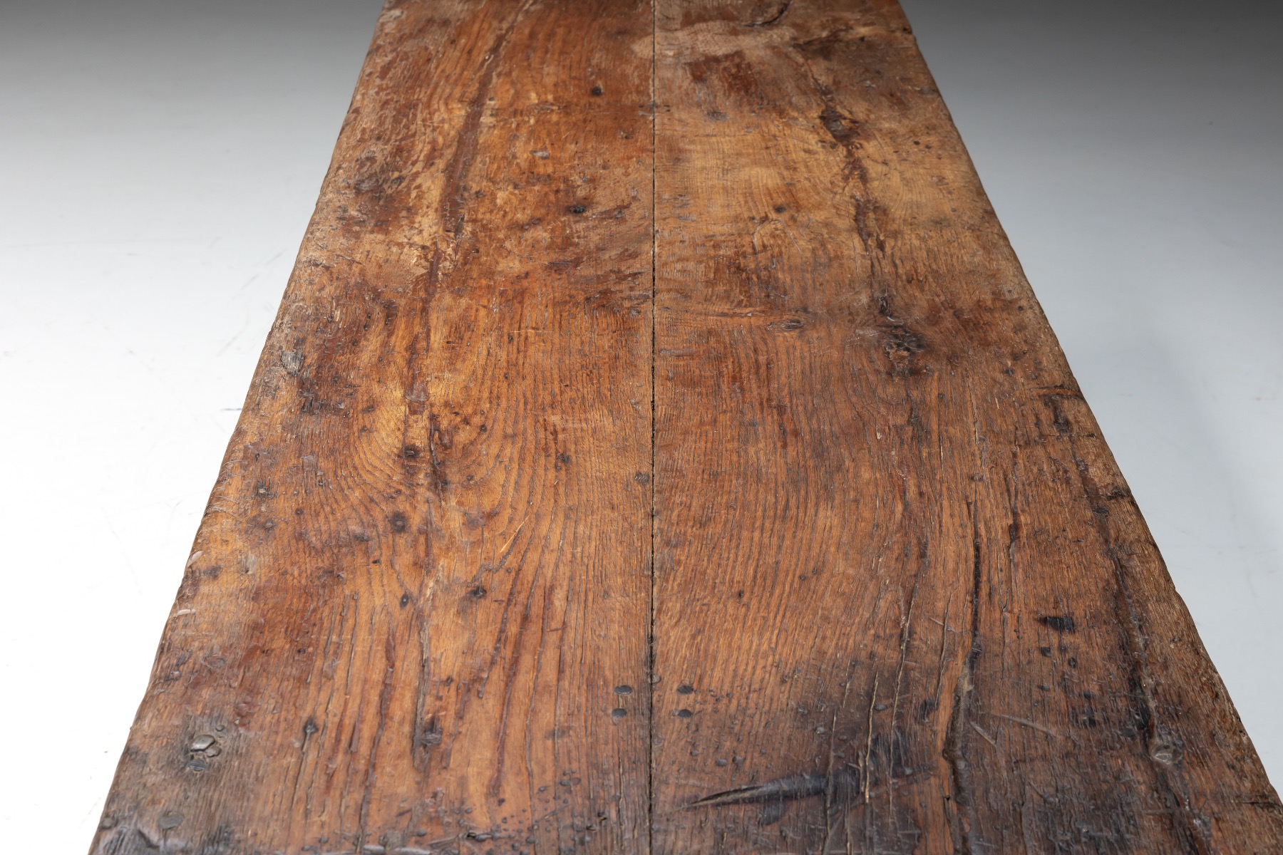 Aged wood farmhouse worktable with natural imperfections