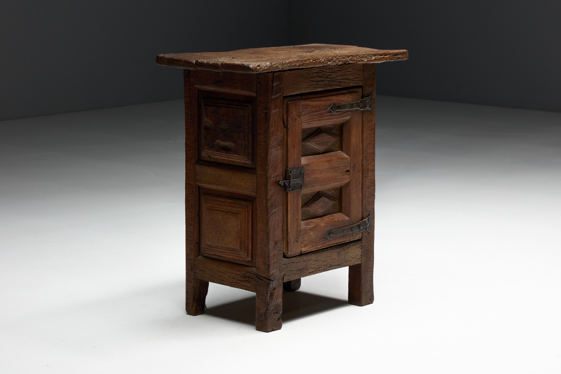 Antique oak cabinet featuring hand forged iron hinges