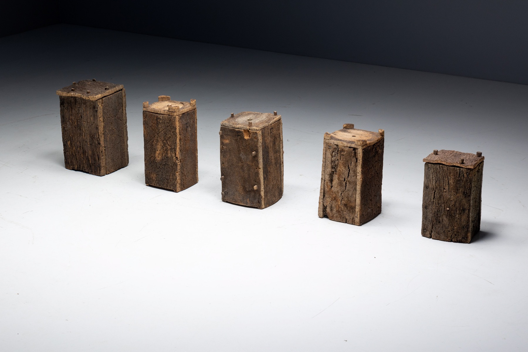 Antique rural log beehives with sculptural presence