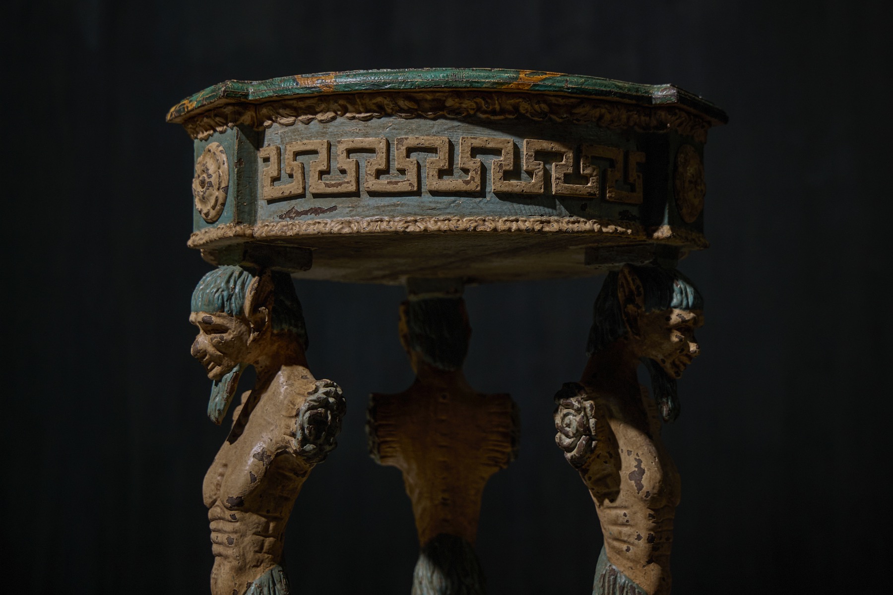 Classical antique tripod table with carved detailing