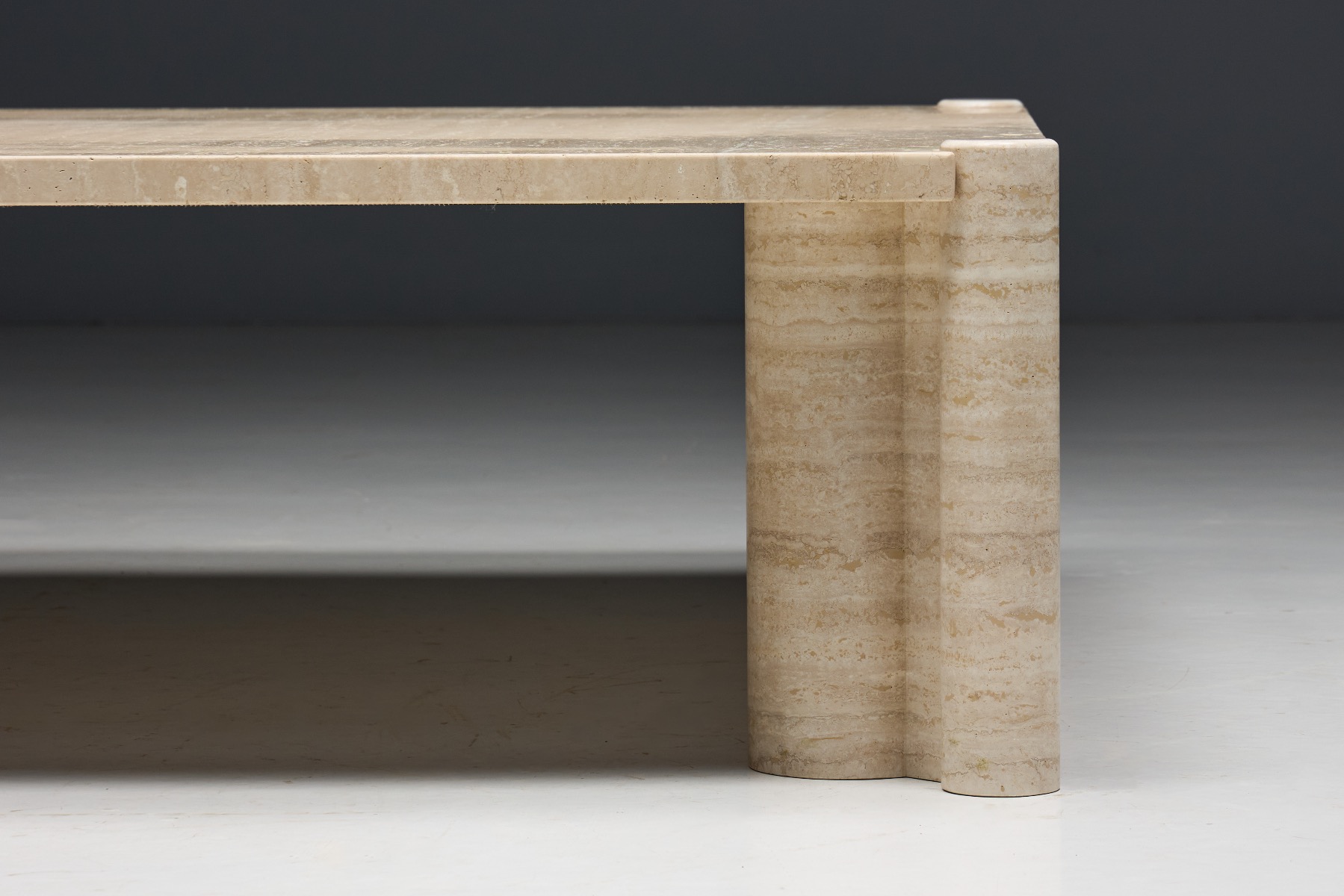 Collectible travertine table by Gae Aulenti