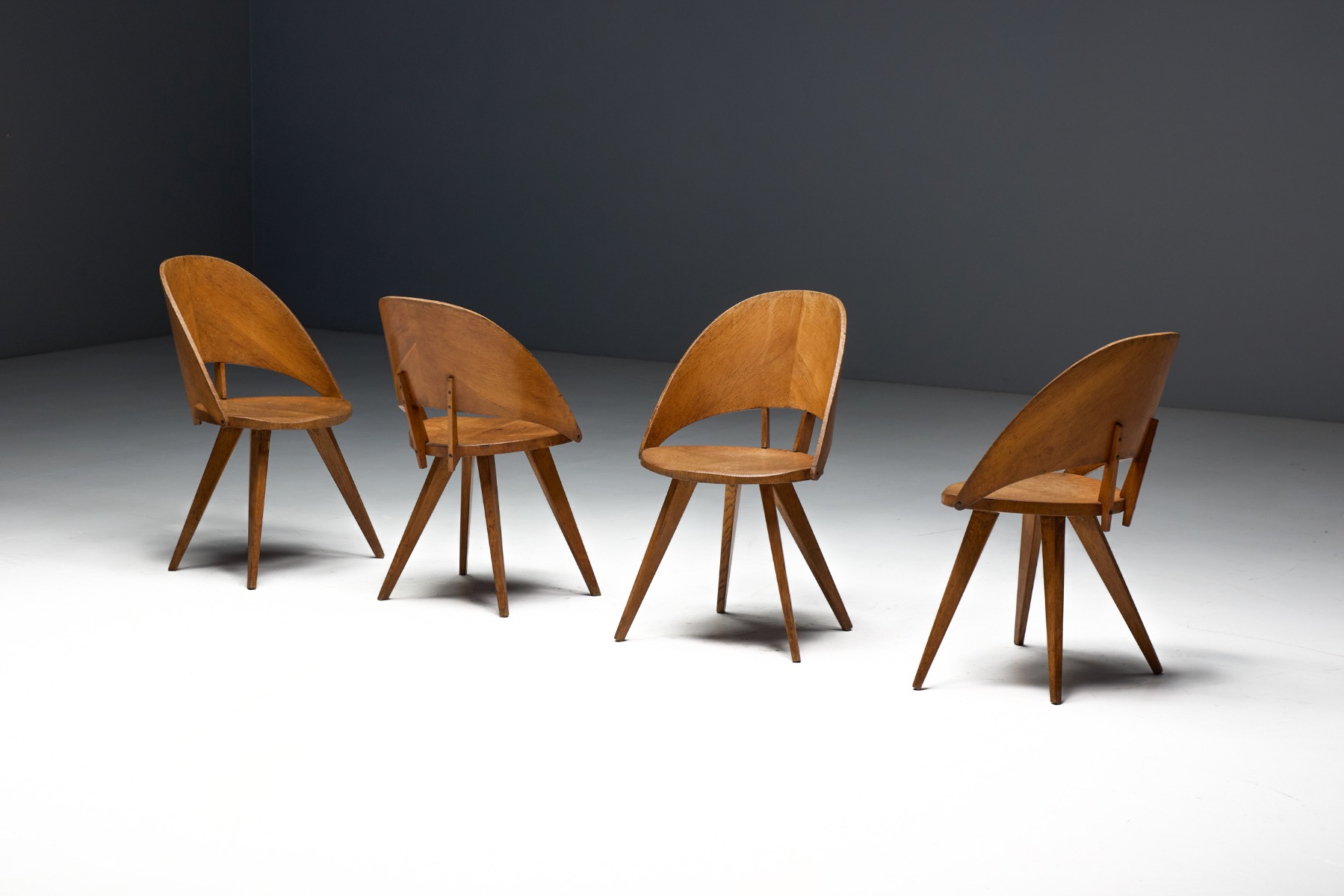 Early modern Italian dining chairs in bent plywood