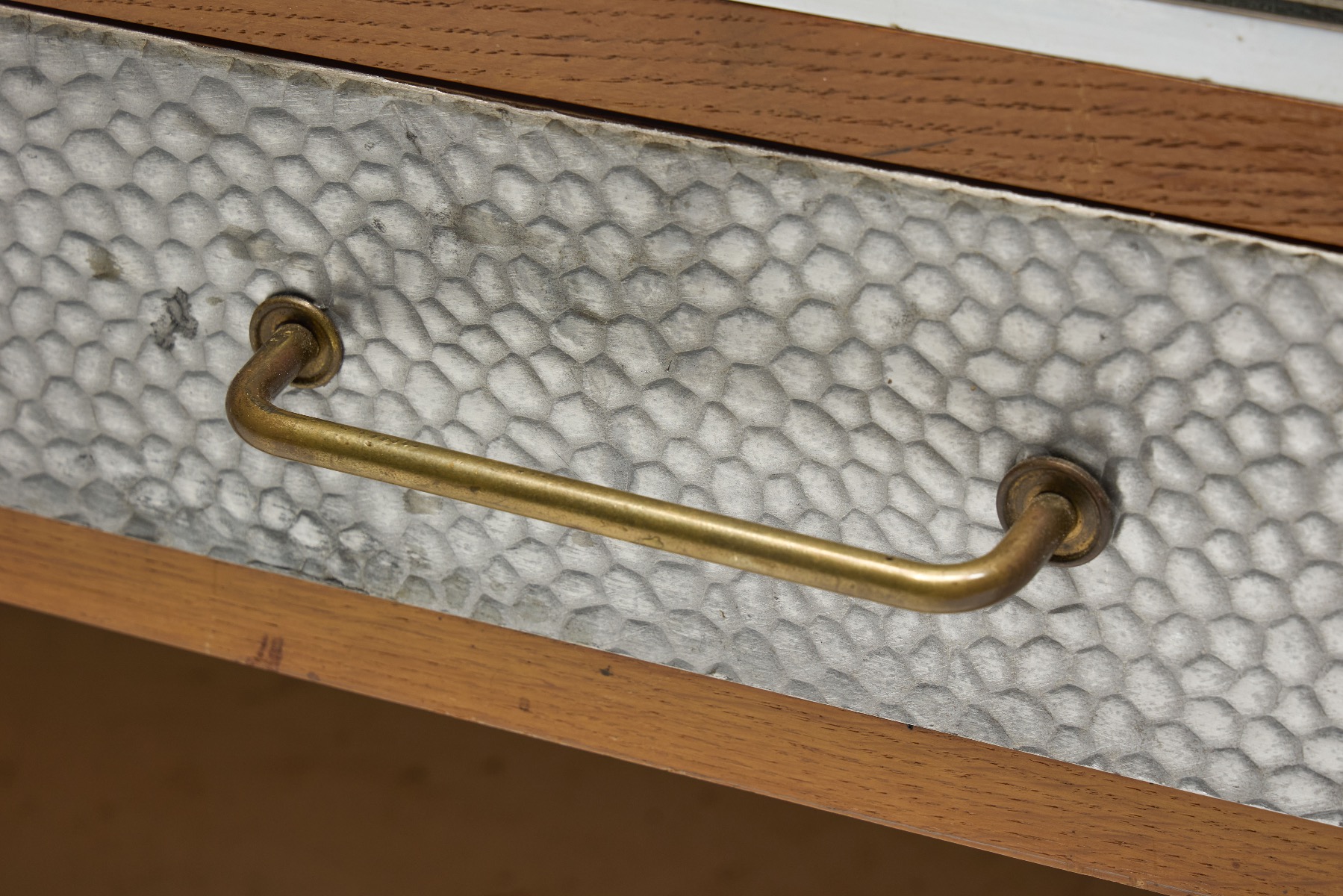 Iconic mid century sideboard with hammered metal surface