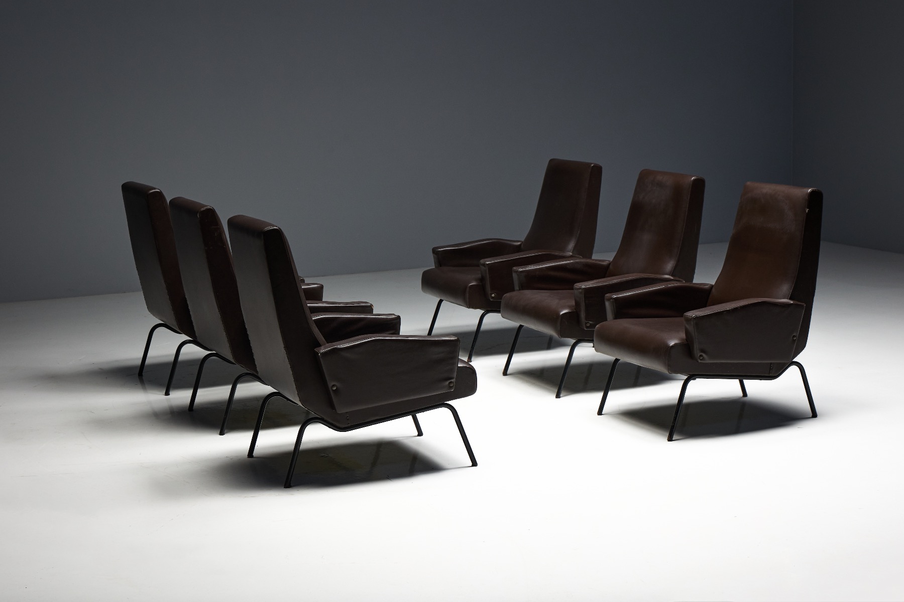 Modernist Italian inspired lounge chair with elegant silhouette