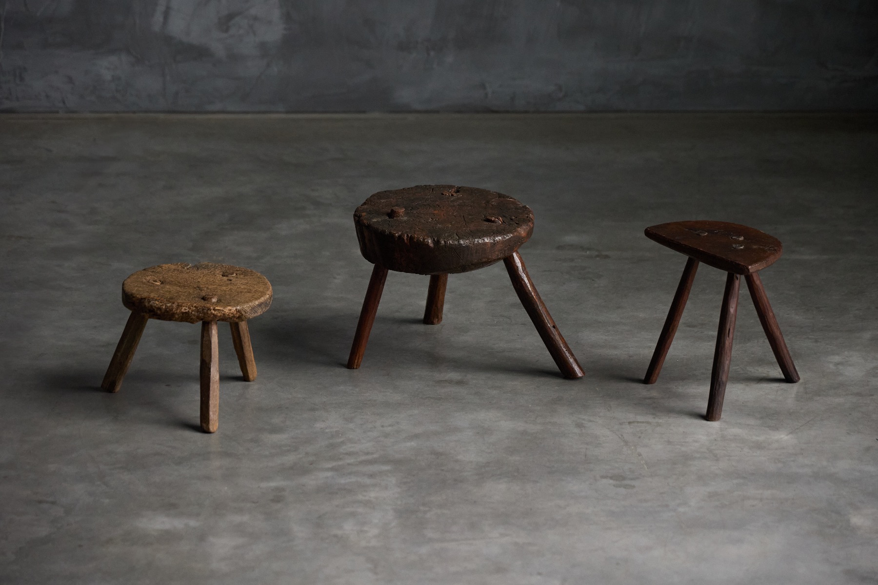 Aged wooden stools with primitive construction