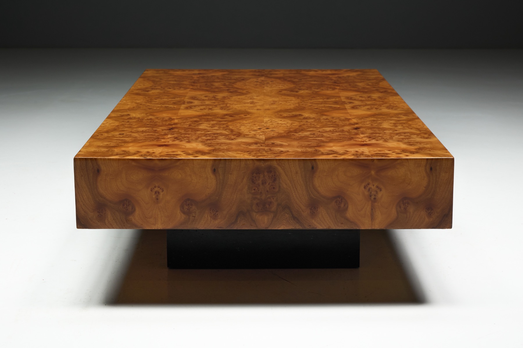 Polished burlwood coffee table showcasing natural burl grain