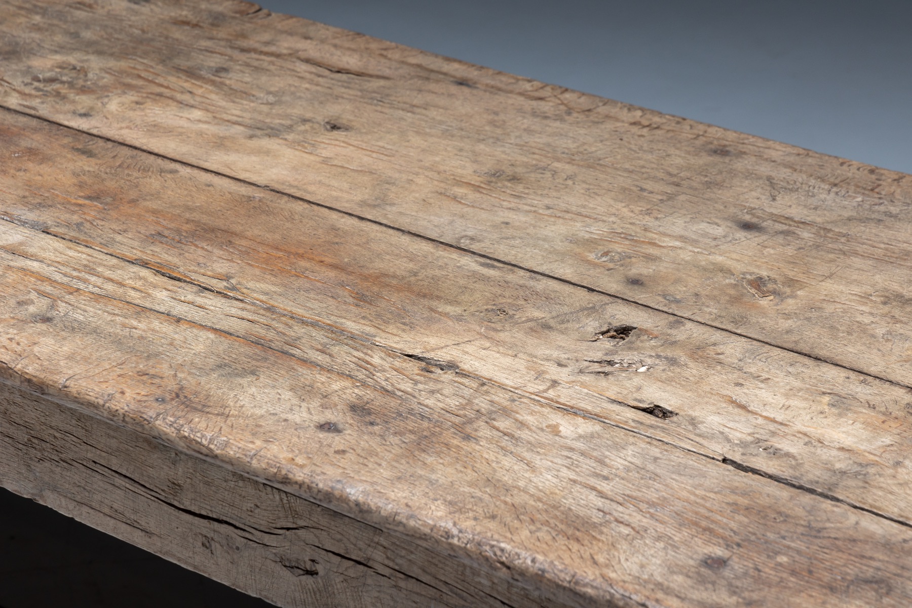 Vernacular rustic farmhouse dining table with utilitarian form