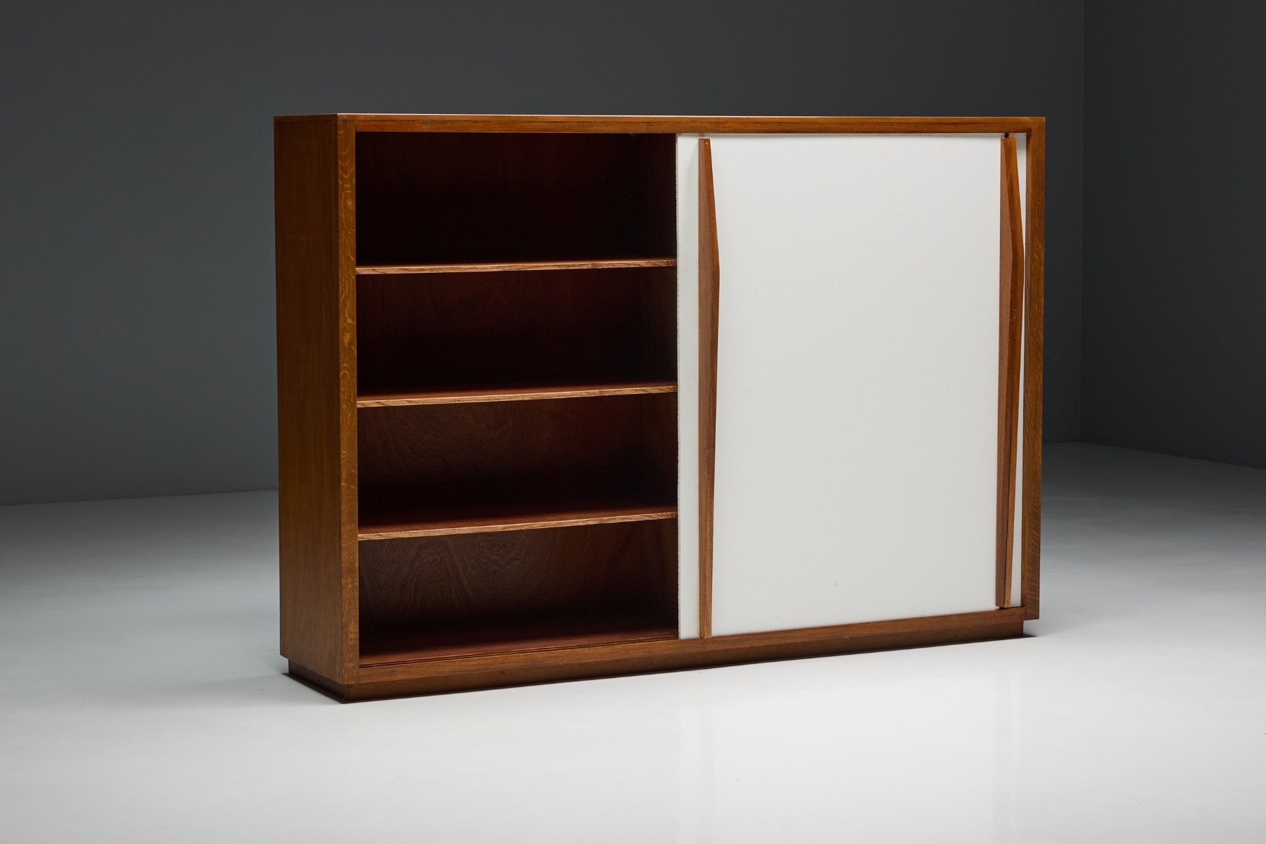 French postwar storage piece with sliding doors, designed by Perriand and Prouv