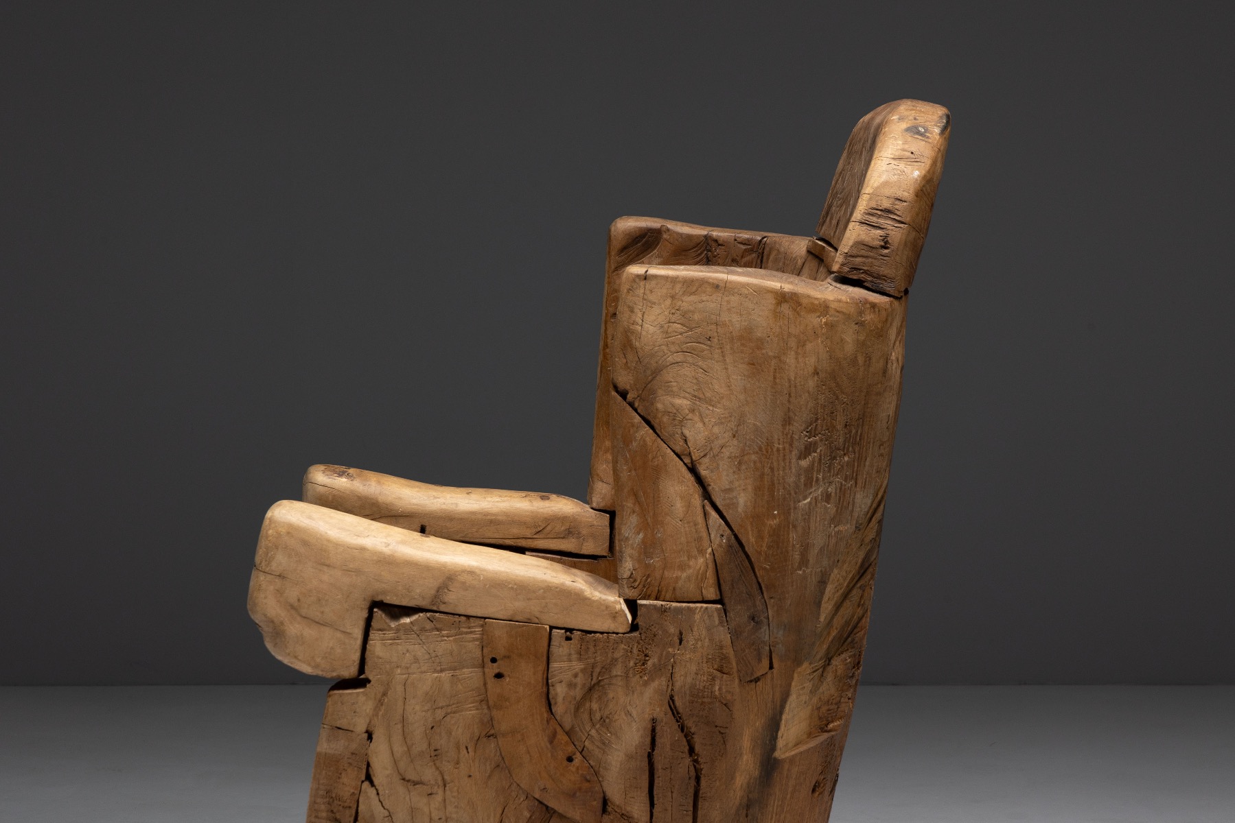Sculpted solid wood throne chair with primitive character