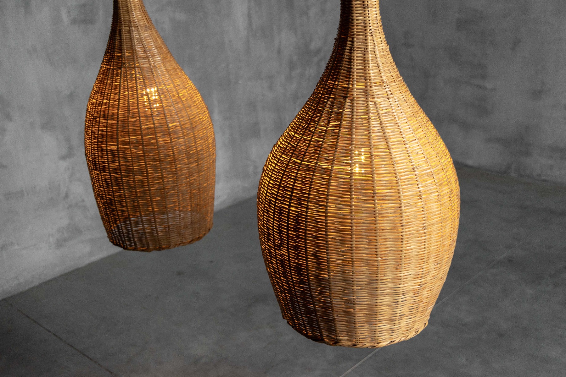 Gallery level rattan pendant lamp with sculptural design