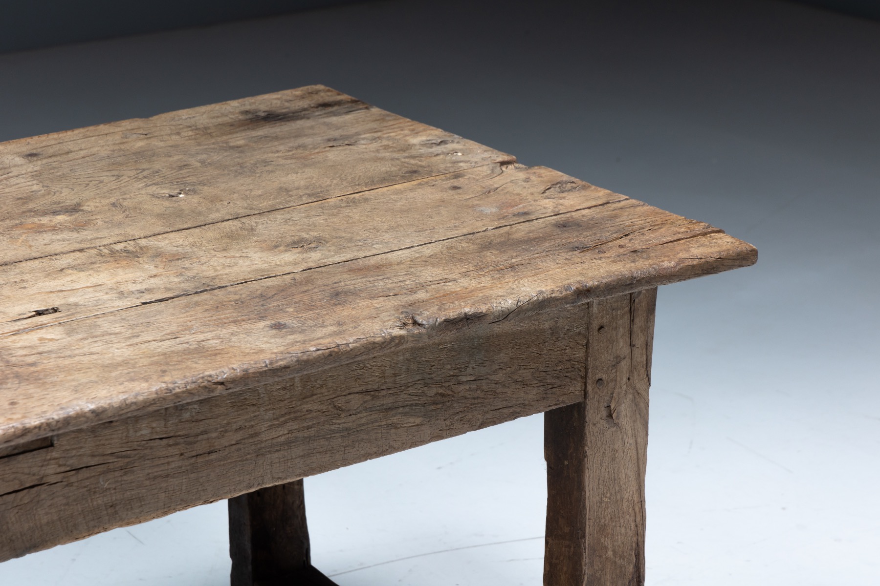 Primitive wooden farmhouse dining table from the 19th century