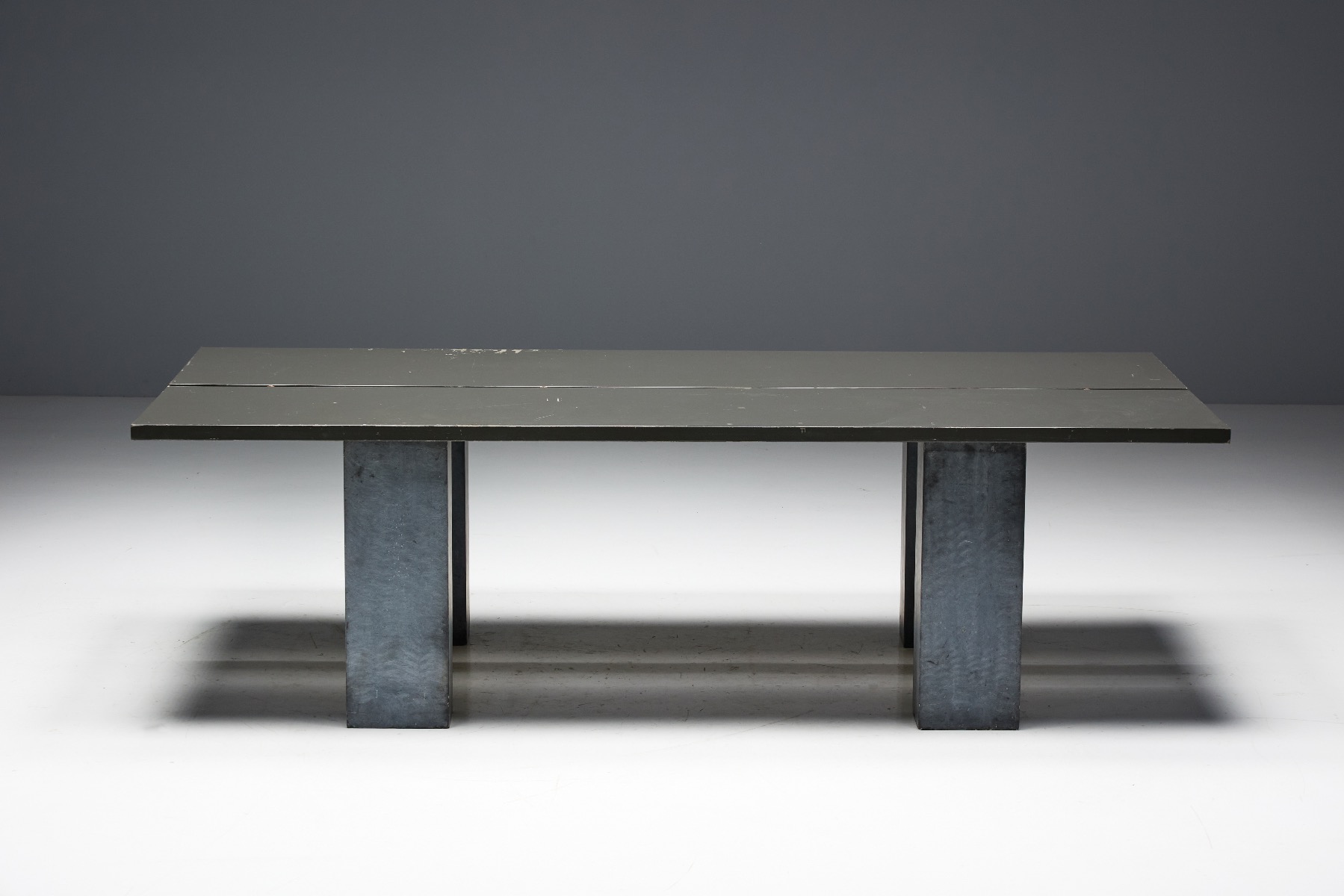 Sculpted brutalist table with stone base