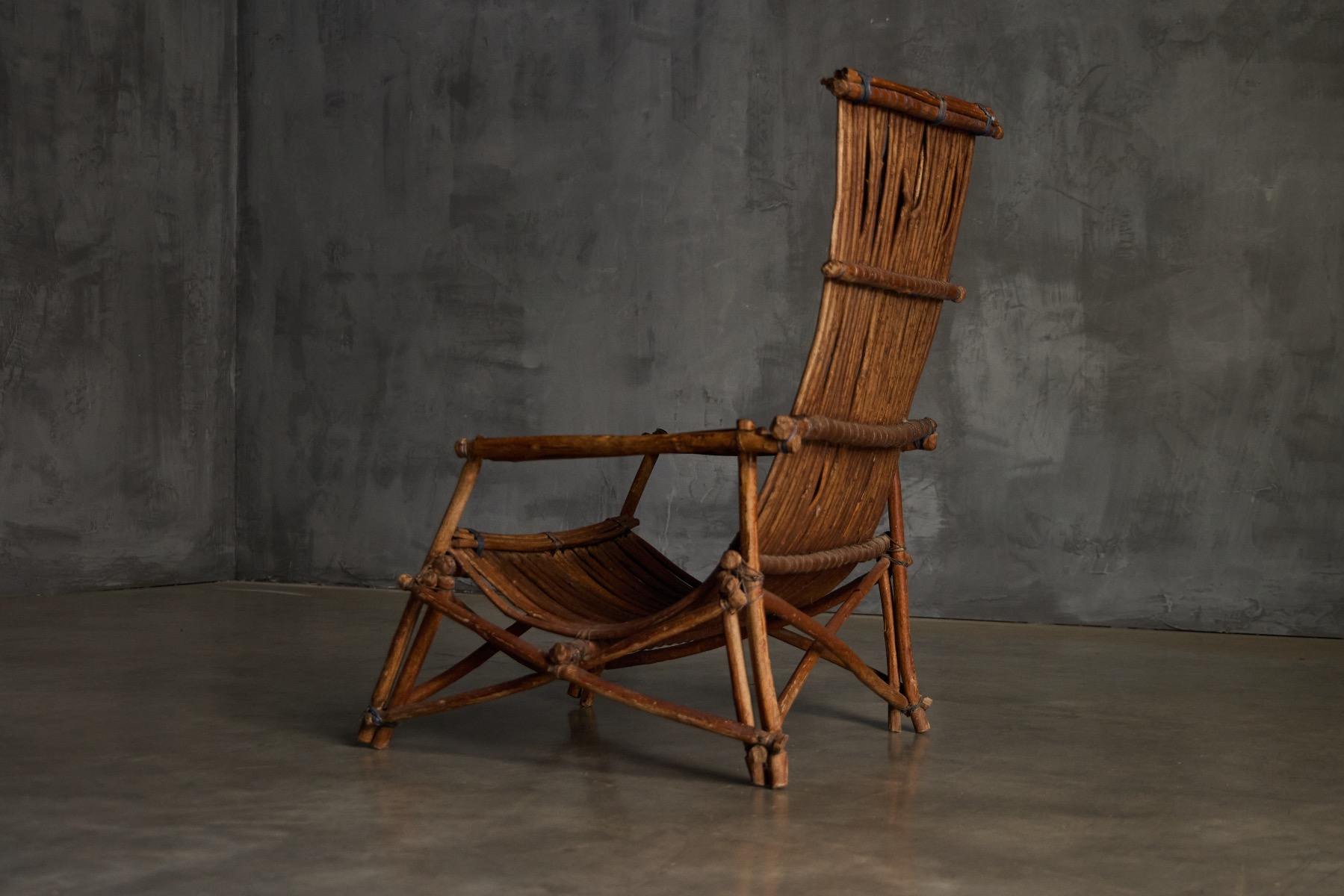 Timeworn wicker reclining chair with authentic patina