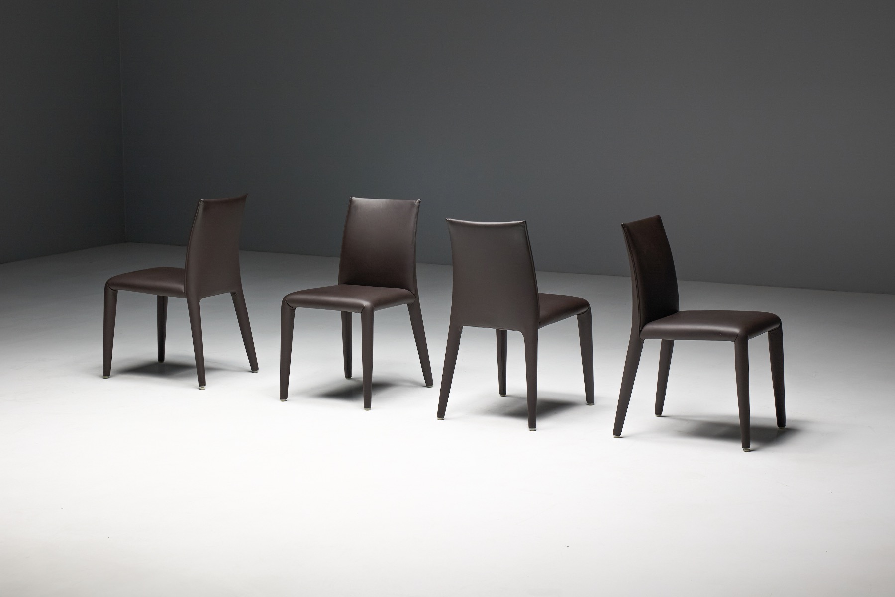 Designer upholstered dining chair with fluid form
