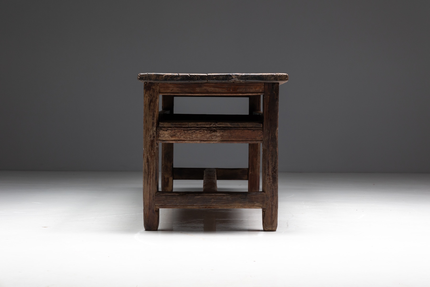 Primitive wooden worktable in vernacular farmhouse tradition