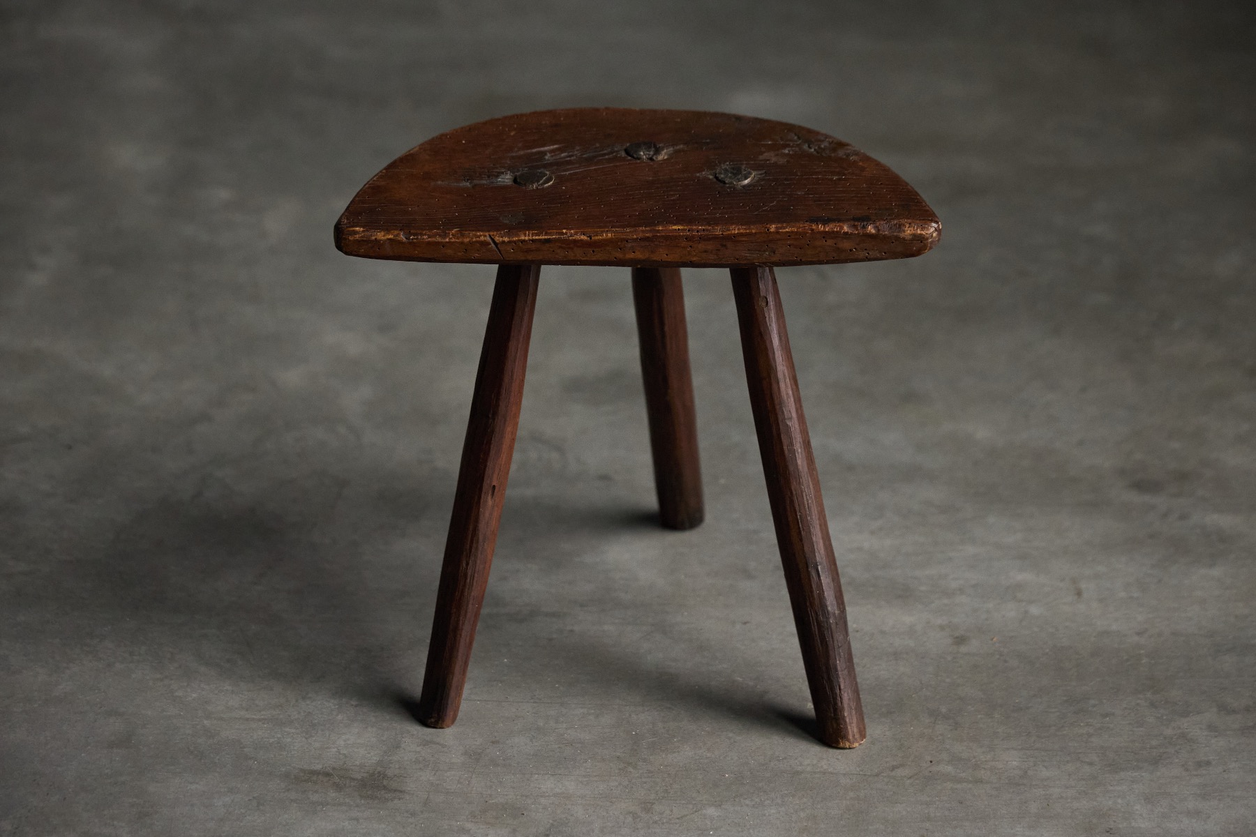 Antique primitive stools with rustic surface