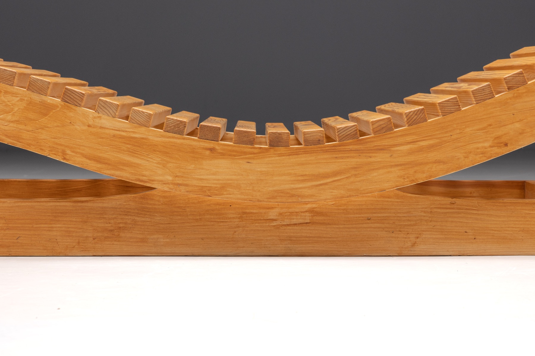 Designer lounge chair by Maison Regain in solid wood
