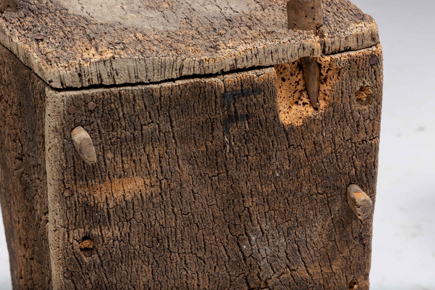 Weathered vernacular beehives with organic aesthetic