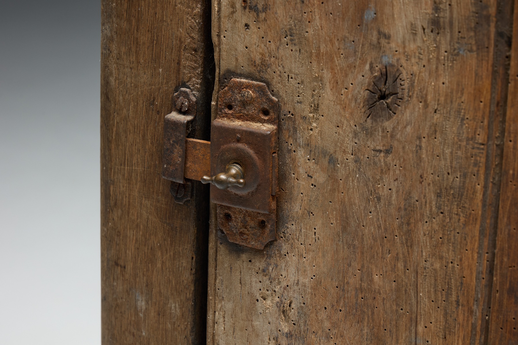 Rustic cabinet with visible patina and rural identity
