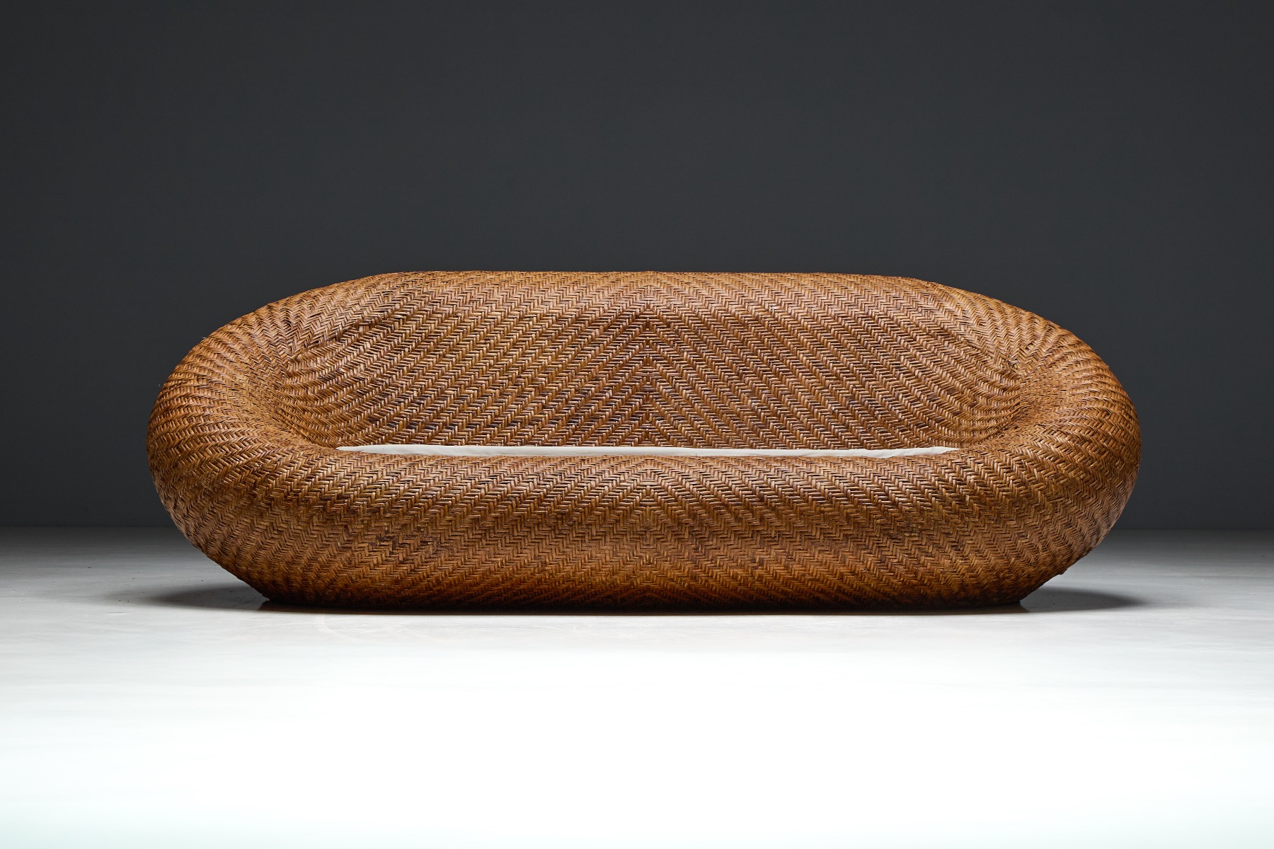 Museum level mid century woven wicker sofa
