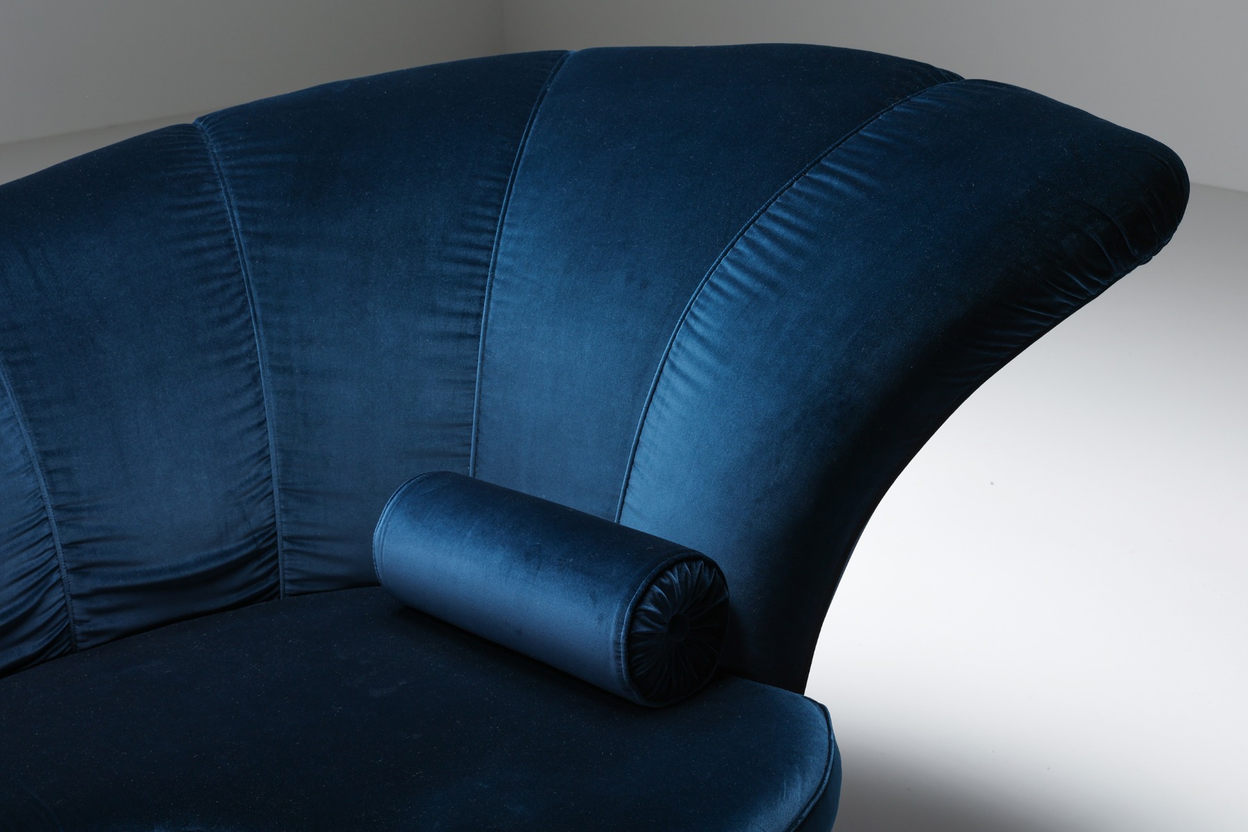 Sculptural Hollywood Regency sofa upholstered in velvet