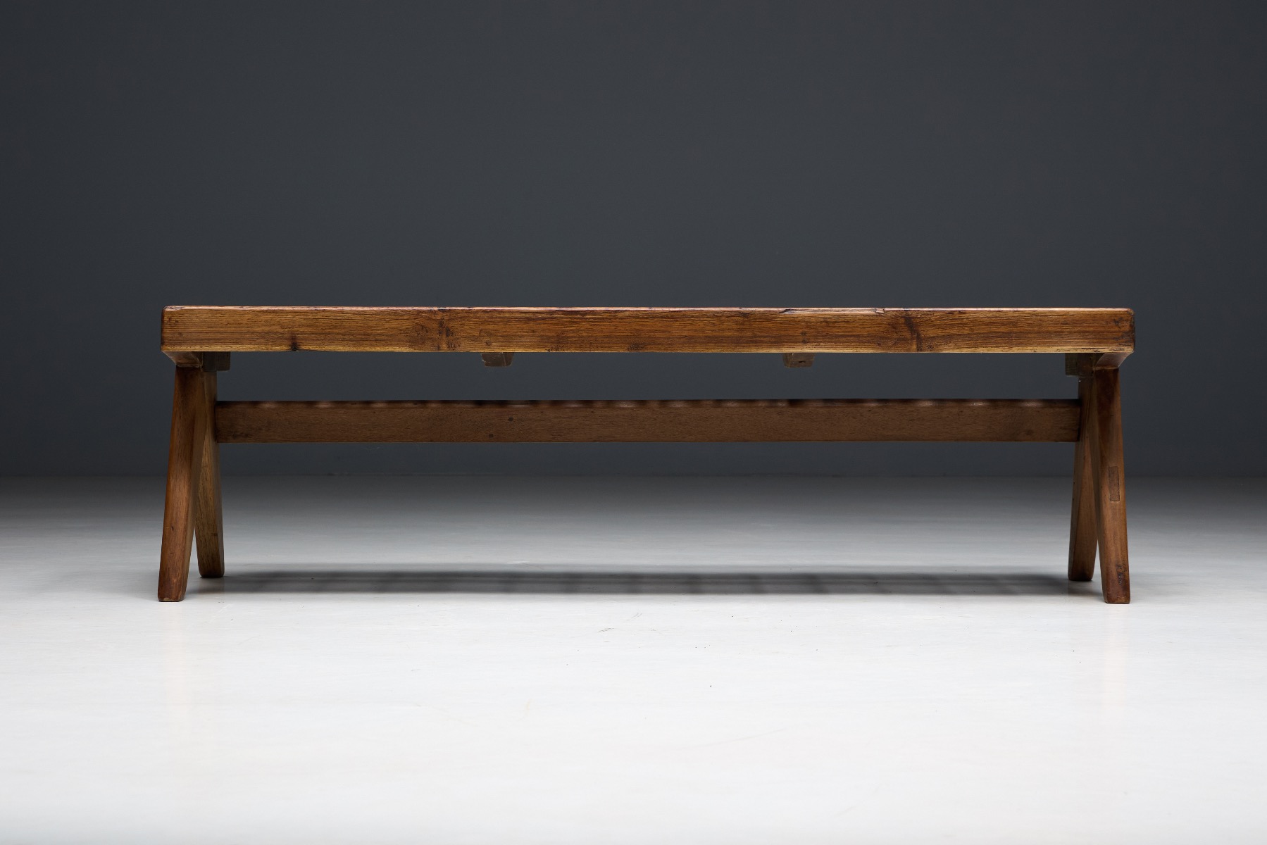 Functionalist teak slatted bench with honest construction
