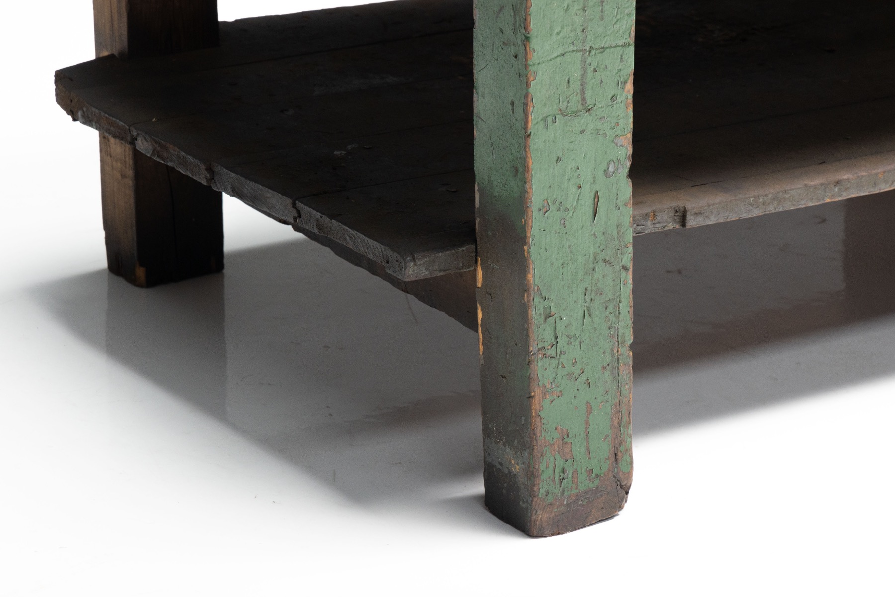Industrial era workbench with original surface patina