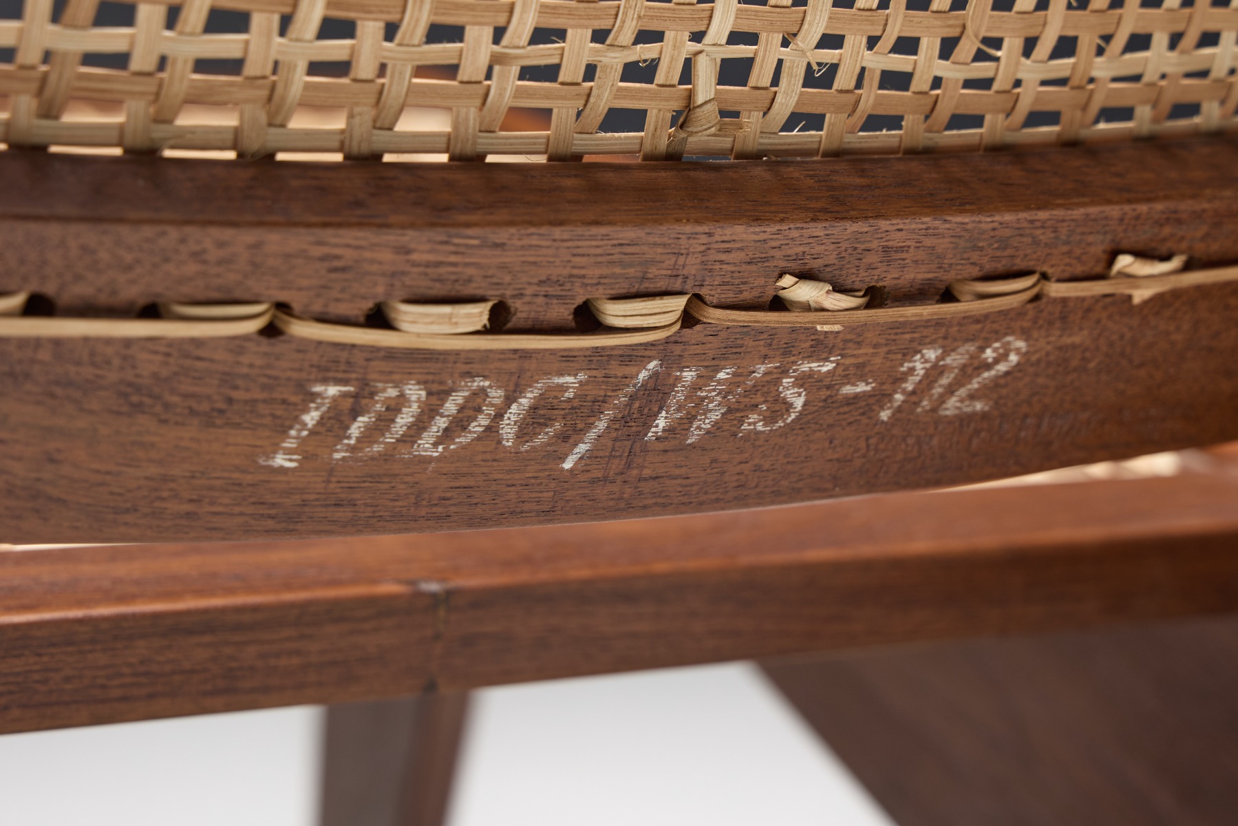 Minimalist kangaroo chairs in Pierre Jeanneret style