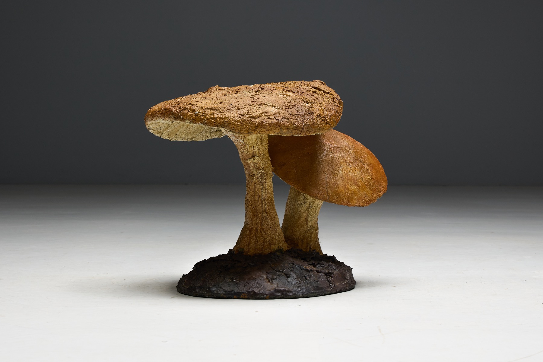 Earth toned sculptural mushroom object with organic design