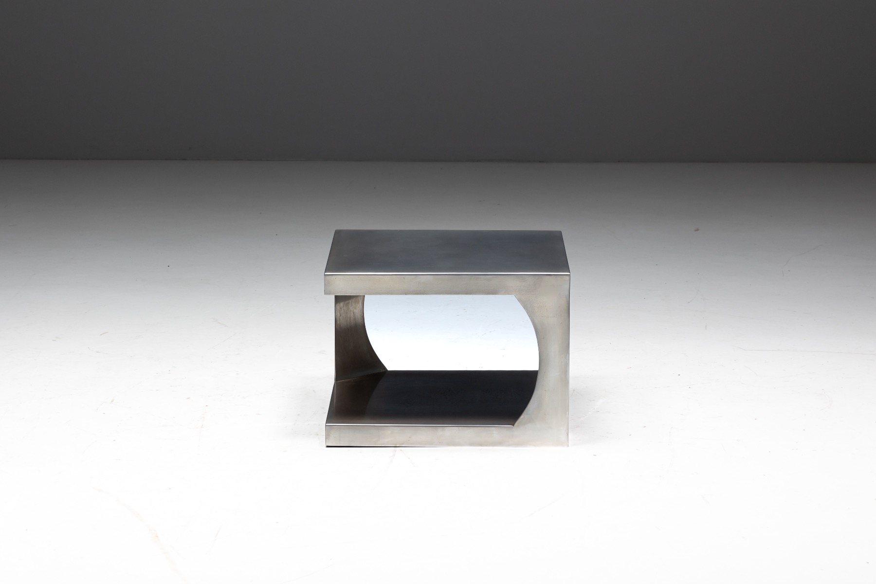 Modernist aluminum furniture side table with strong presence