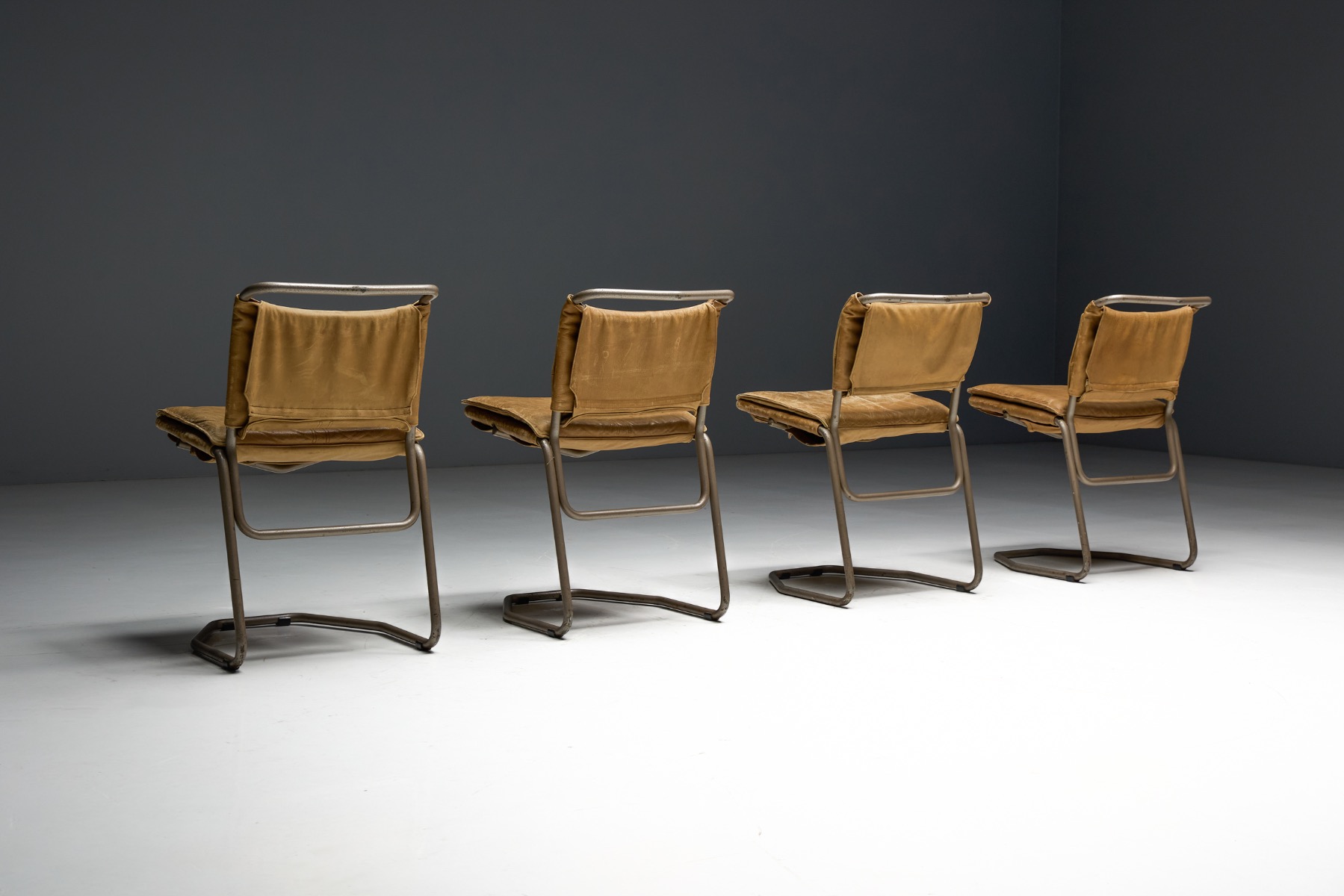 Designer dining chairs in leather and steel by Rombouts