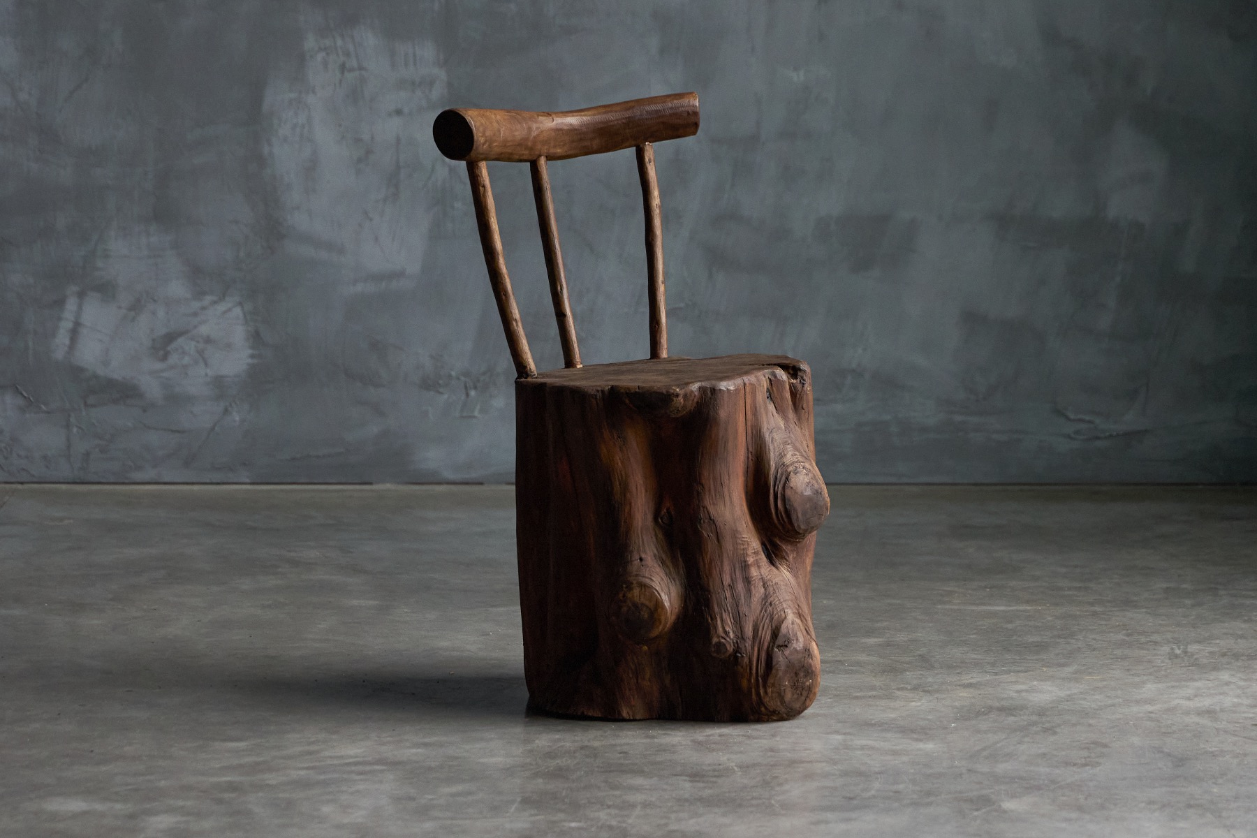 Brutalist monoxyle chair from the 1970s carved from solid wood