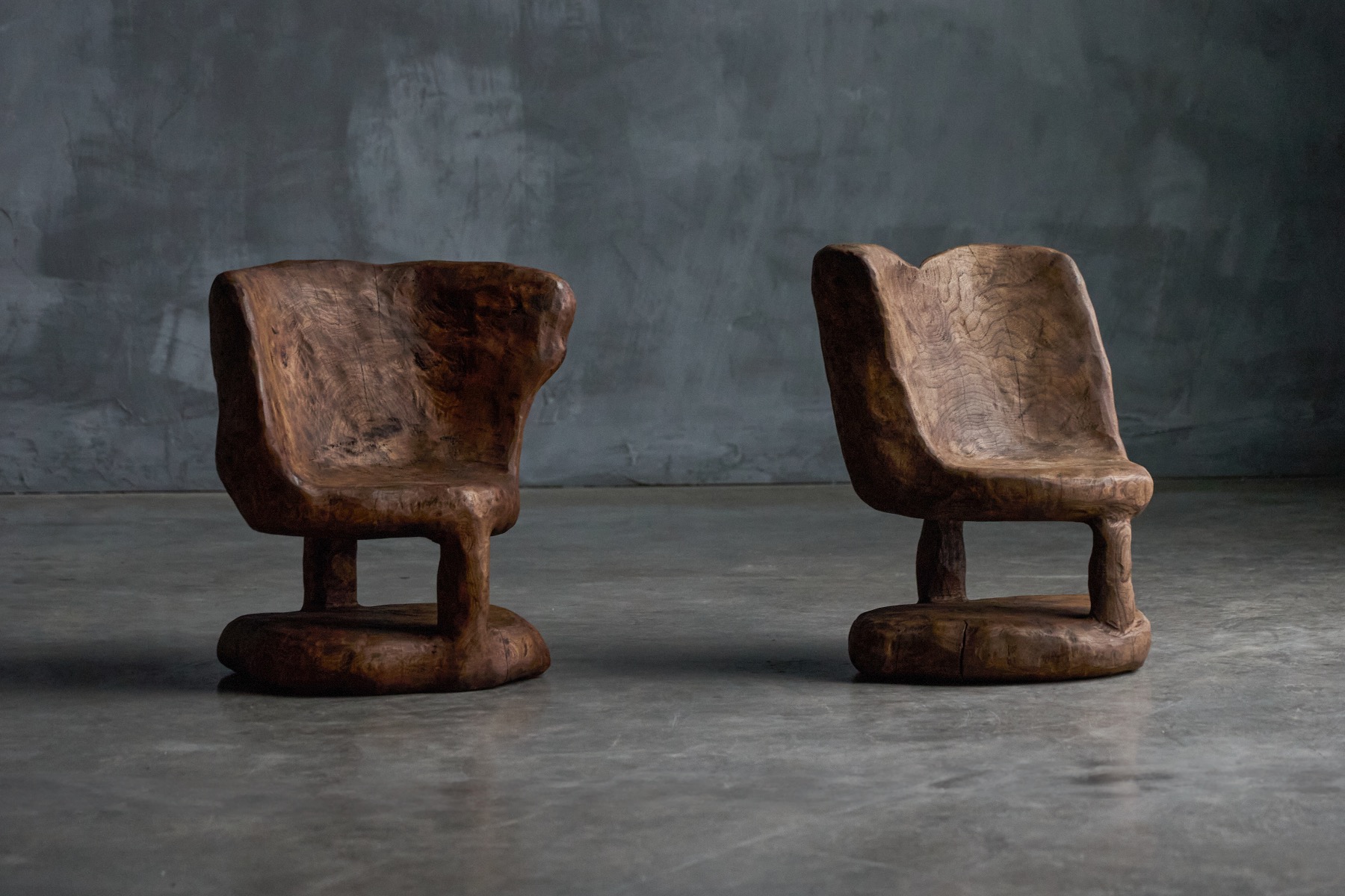 Brutalist monoxyle chairs from the 1980s carved from solid wood