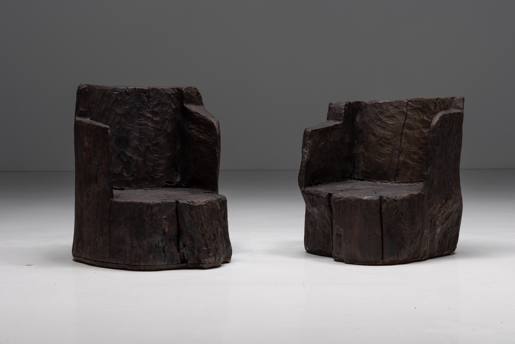 Brutalist monoxylite armchairs from the 1980s