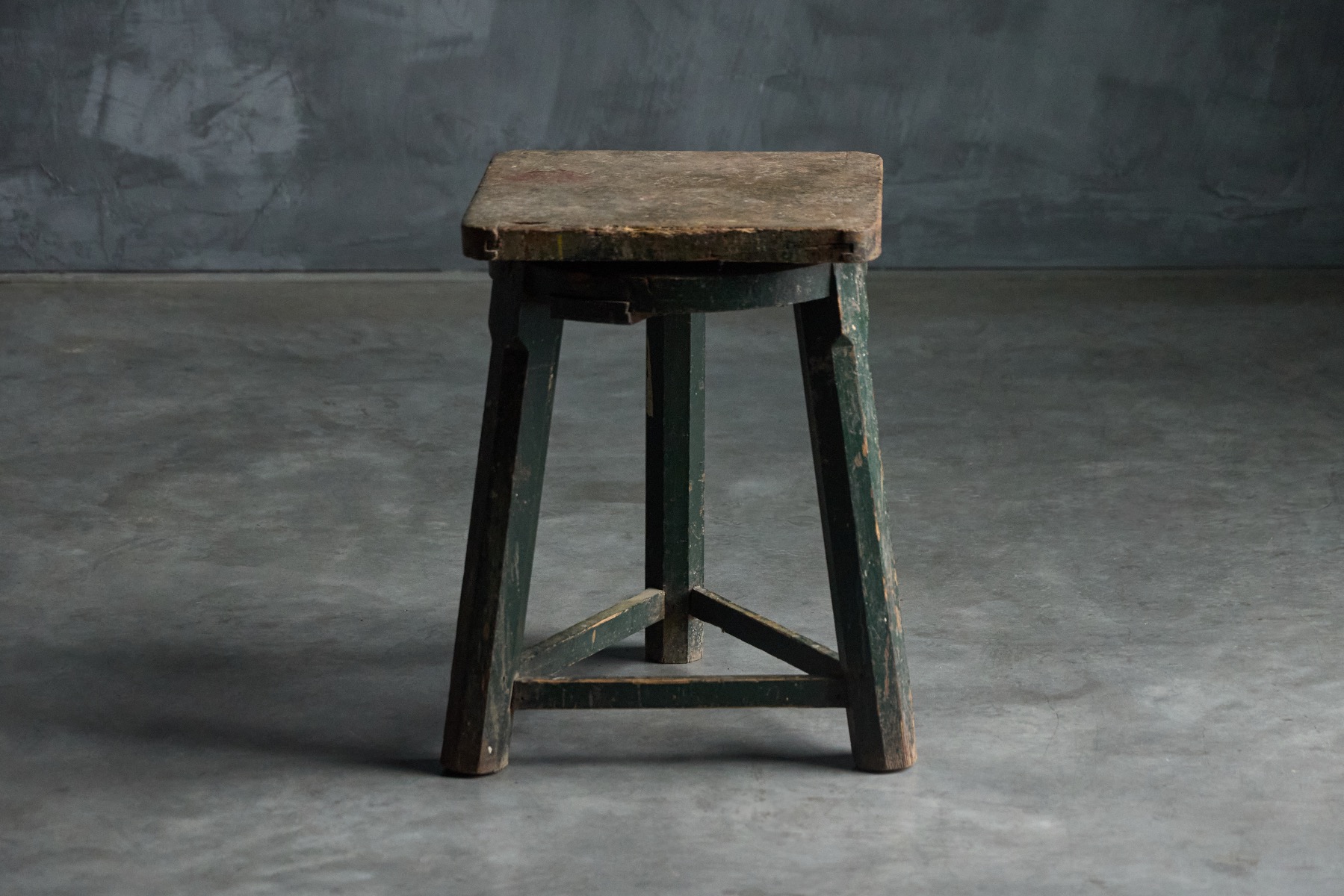 Industrial primitive stool from the 19th century in solid wood