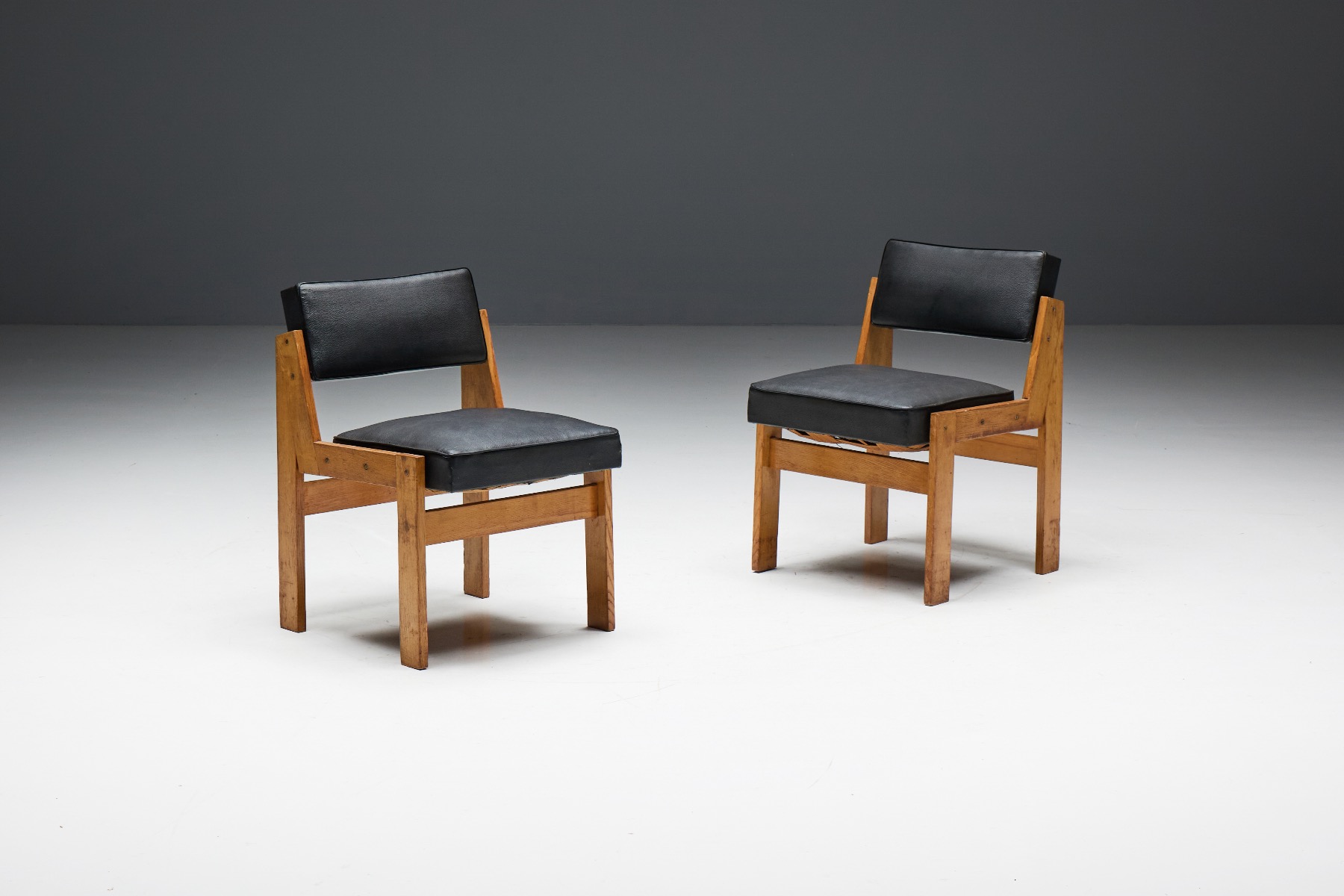 Modernist chairs by Wim den Boon in oak and vinyl from the 1950s