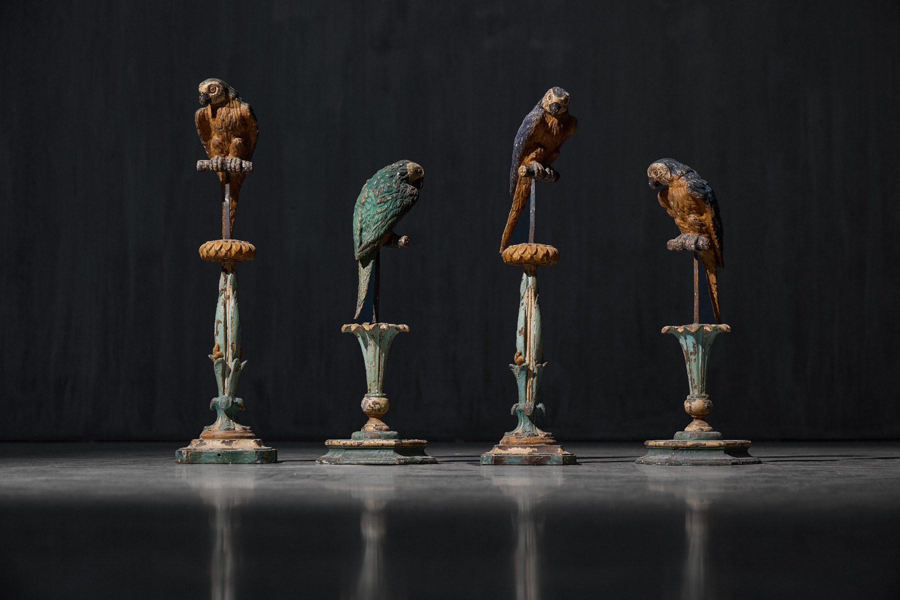 Neoclassical parrot sculptures on pedestals from the 19th century