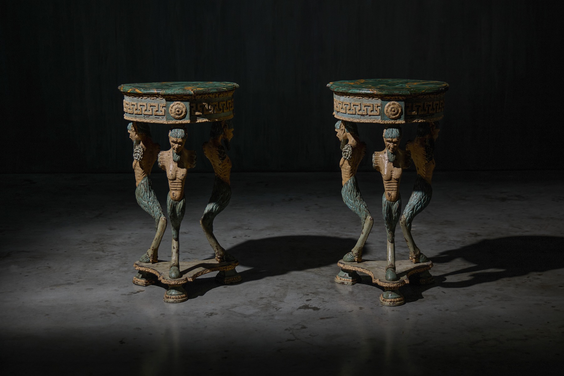 Neoclassical tripod gueridon tables with satyr supports from the early 19th century