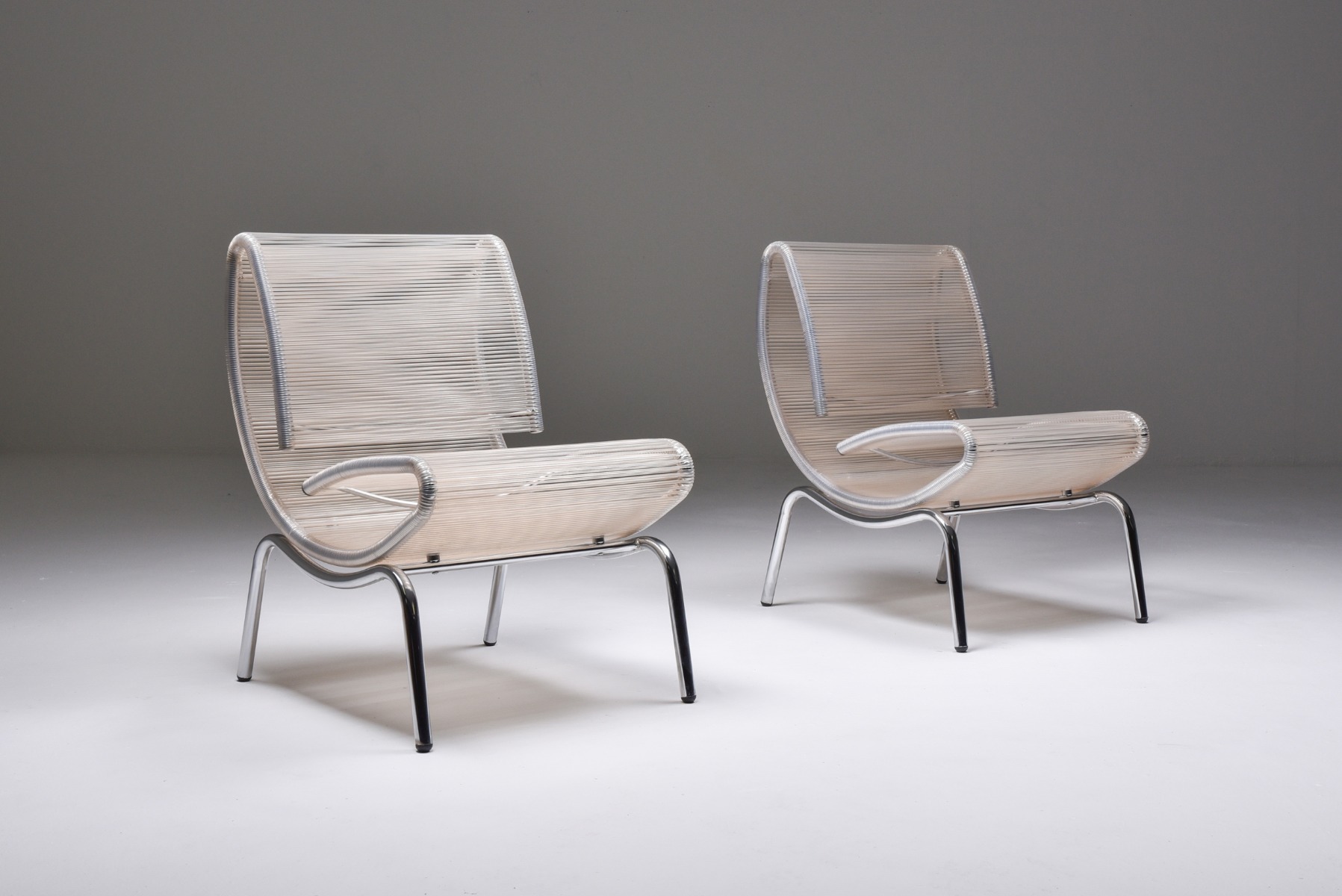 Post modern easy chairs in chrome and plastic wire from the 1960s