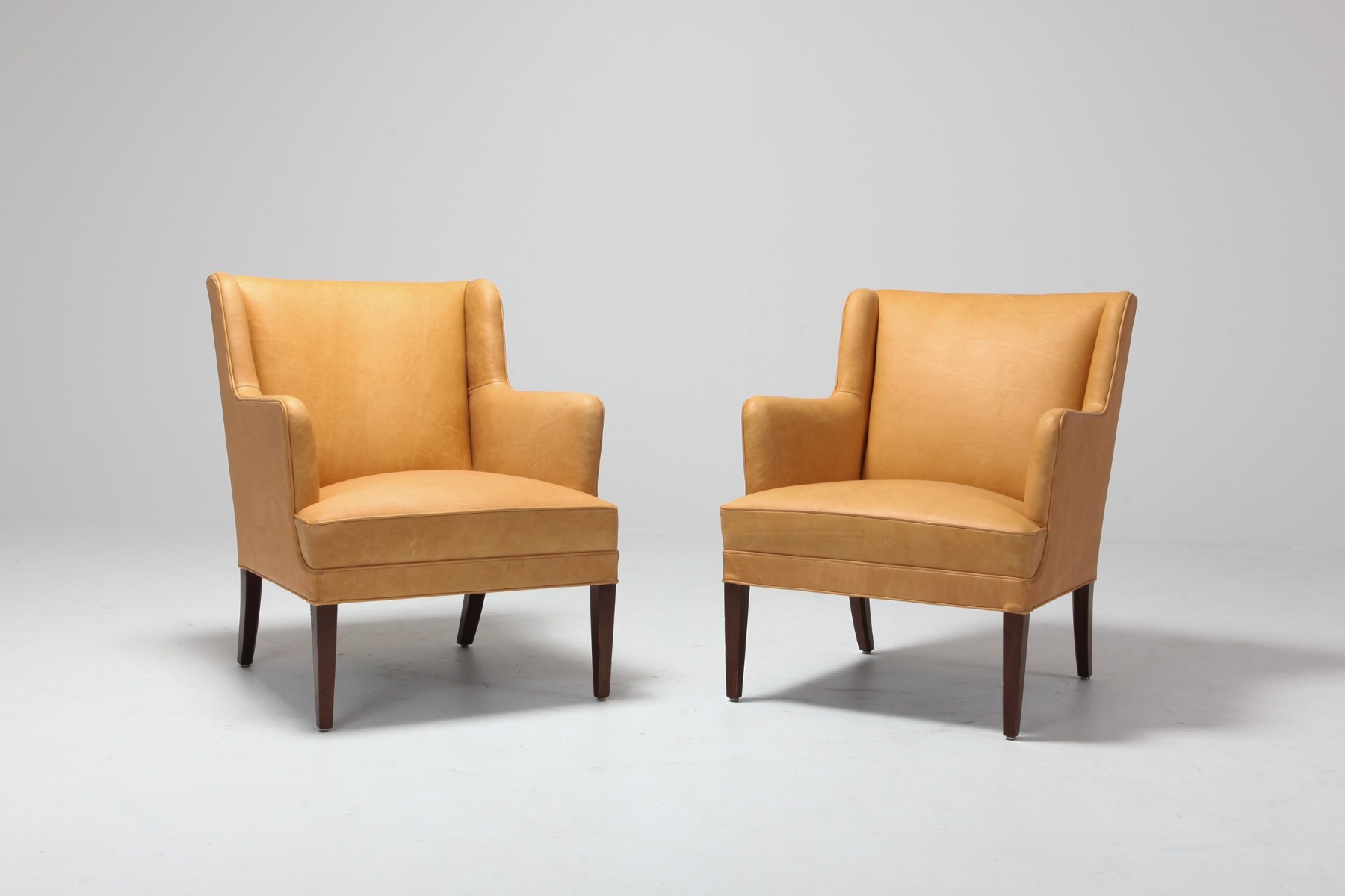 Scandinavian modern bergere chairs in camel leather from the 1960s