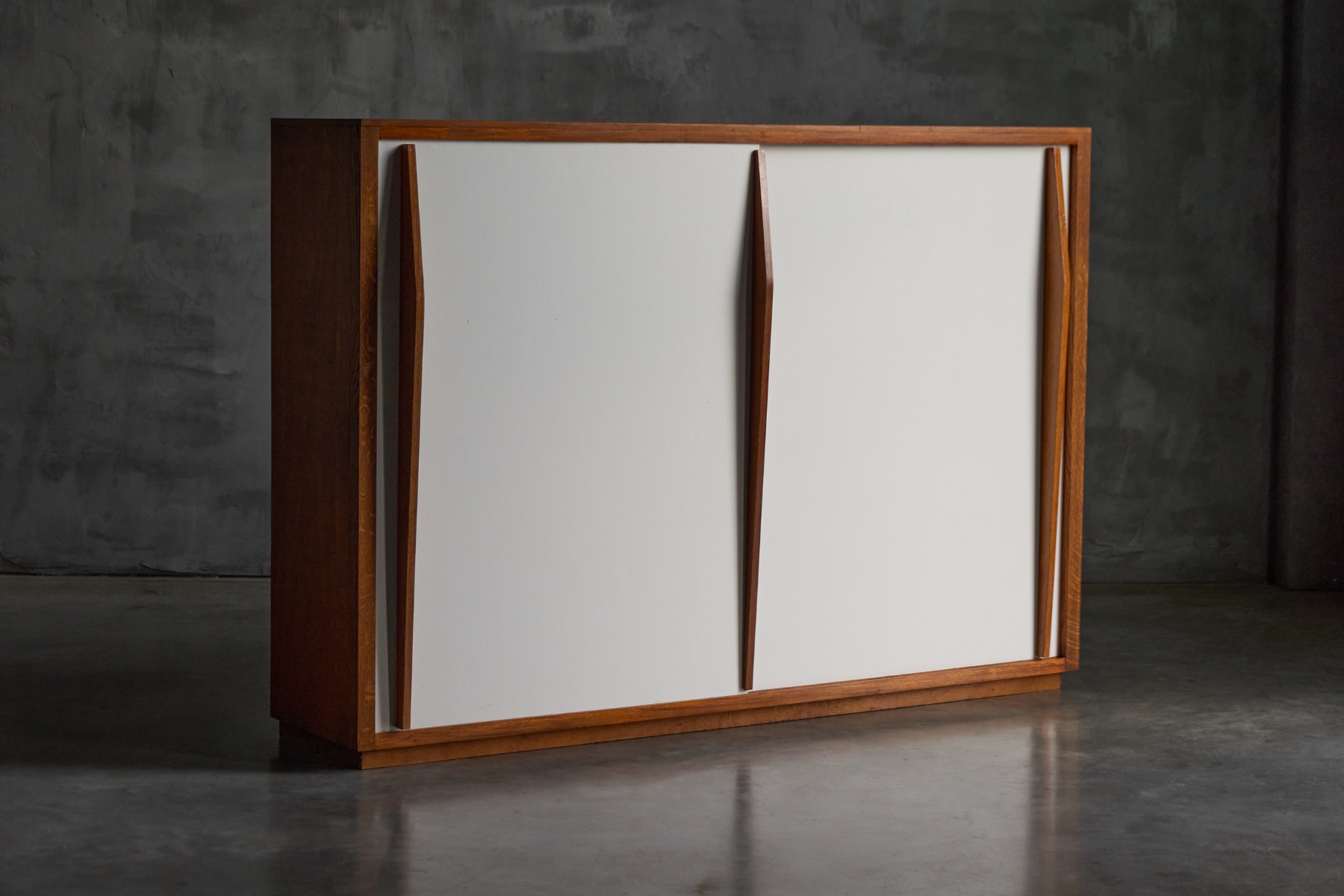 Storage piece with integrated sliding doors by Charlotte Perriand and Atelier Jean Prouvé, France 1950s