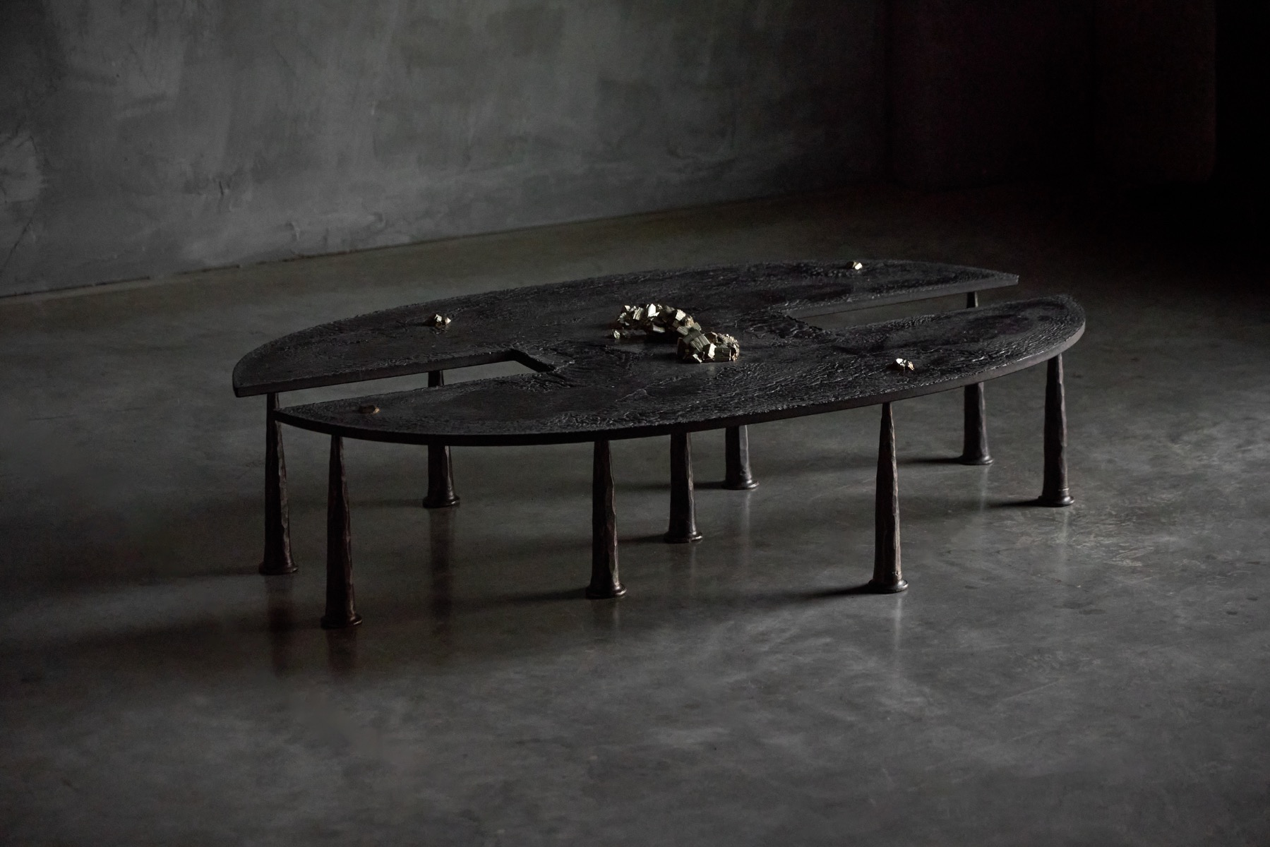 Brutalist iron coffee table with mineral inclusions designed by Thomas Serruys in 2019