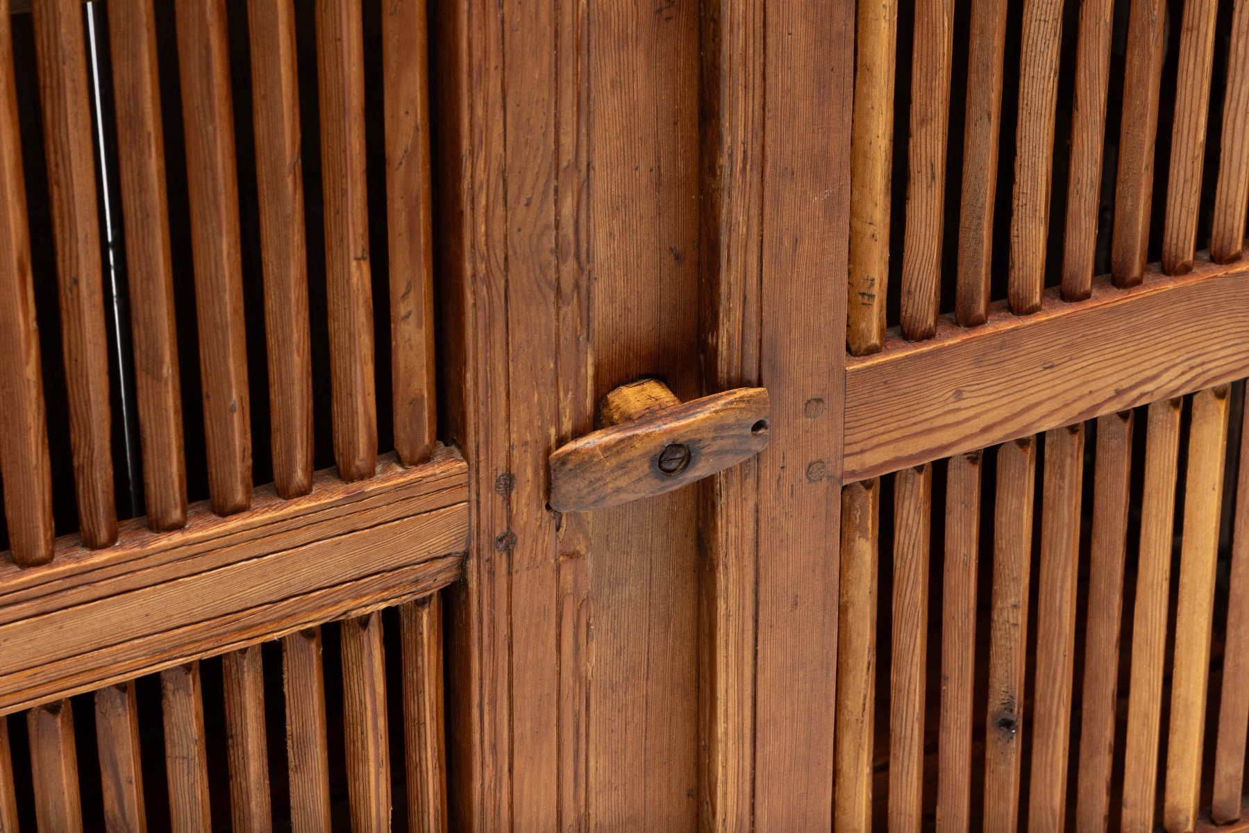 Gallery level alpine tommière cabinet with sculptural presence